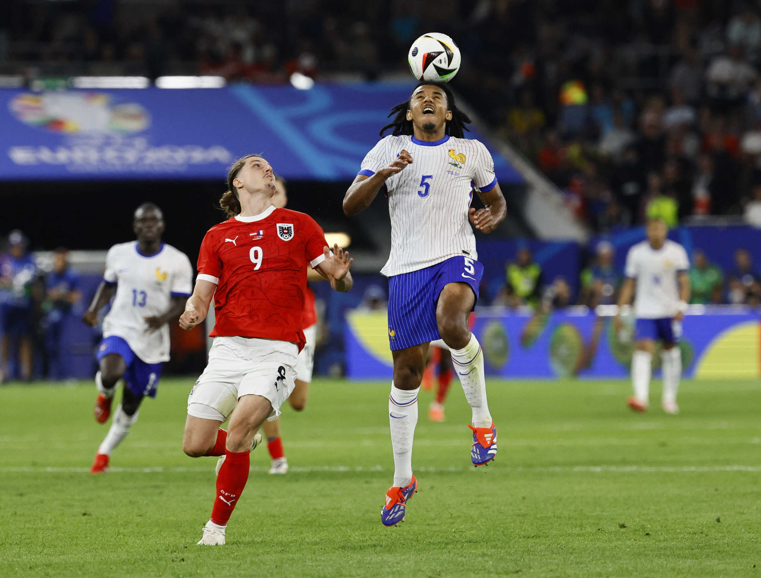 Soccer Football - Euro 2024 - Group D - Austria v France - Dusseldorf Arena, Dusseldorf, Germany - June 17, 2024 France's Jules Kounde in action with Austria's Marcel Sabitzer REUTERS