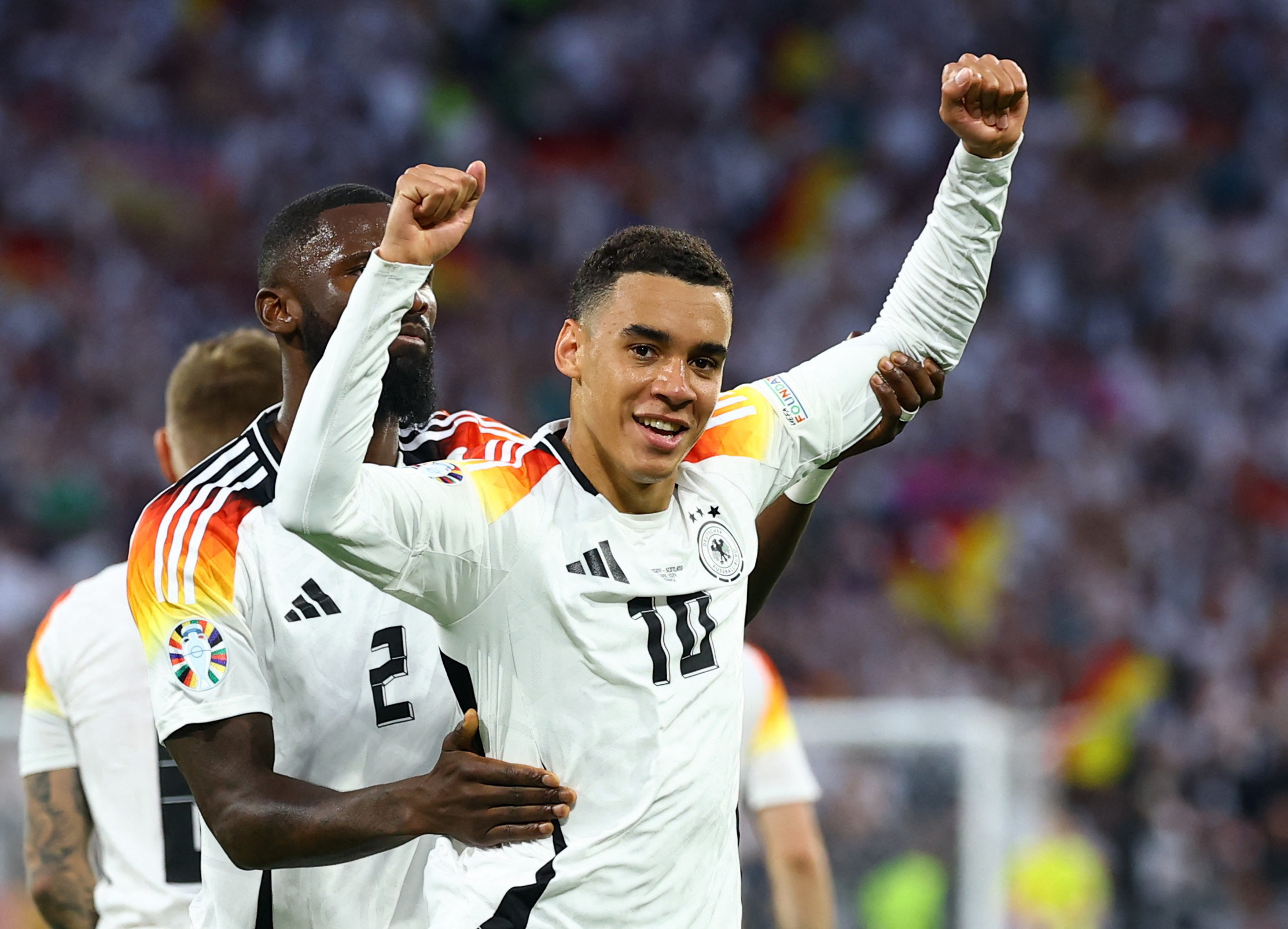 Soccer Football - Euro 2024 - Group A - Germany v Scotland - Munich Football Arena, Munich, Germany - June 14, 2024   Germany's Jamal Musiala celebrates scoring their second goal with Antonio Rudiger REUTERS