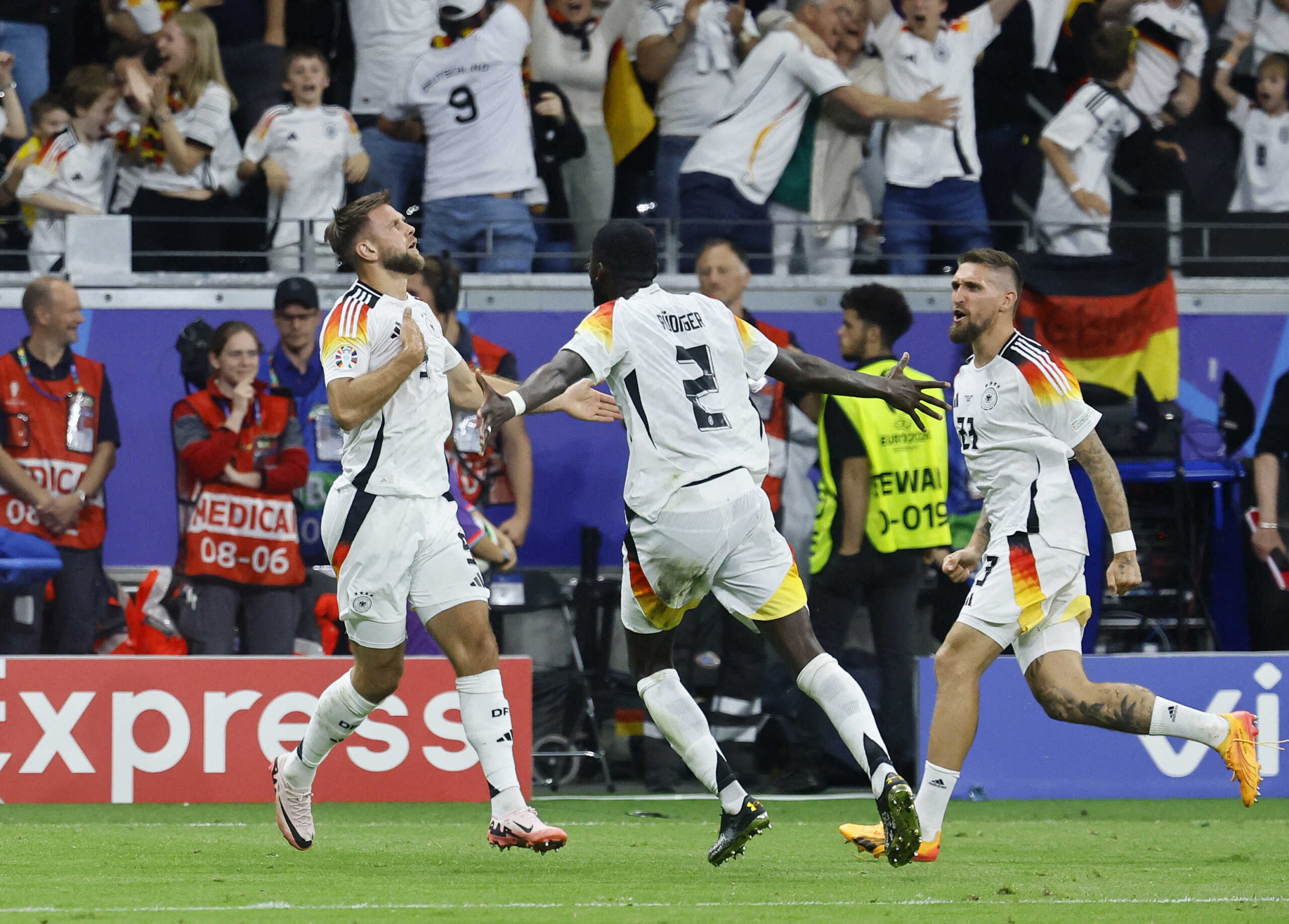 Soccer Football - Euro 2024 - Group A - Switzerland v Germany - Frankfurt, Germany - June 23, 2024 Germany's Niclas Fullkrug celebrates scoring their first goal with Robert Andrich and Antonio Rudiger REUTERS