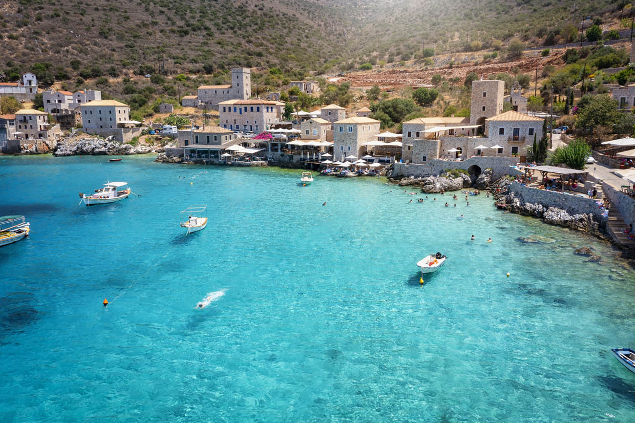 The beautiful village Limeni on the south Mani coast, Peloponnese, Greece, with shining, turquoise sea during summer time