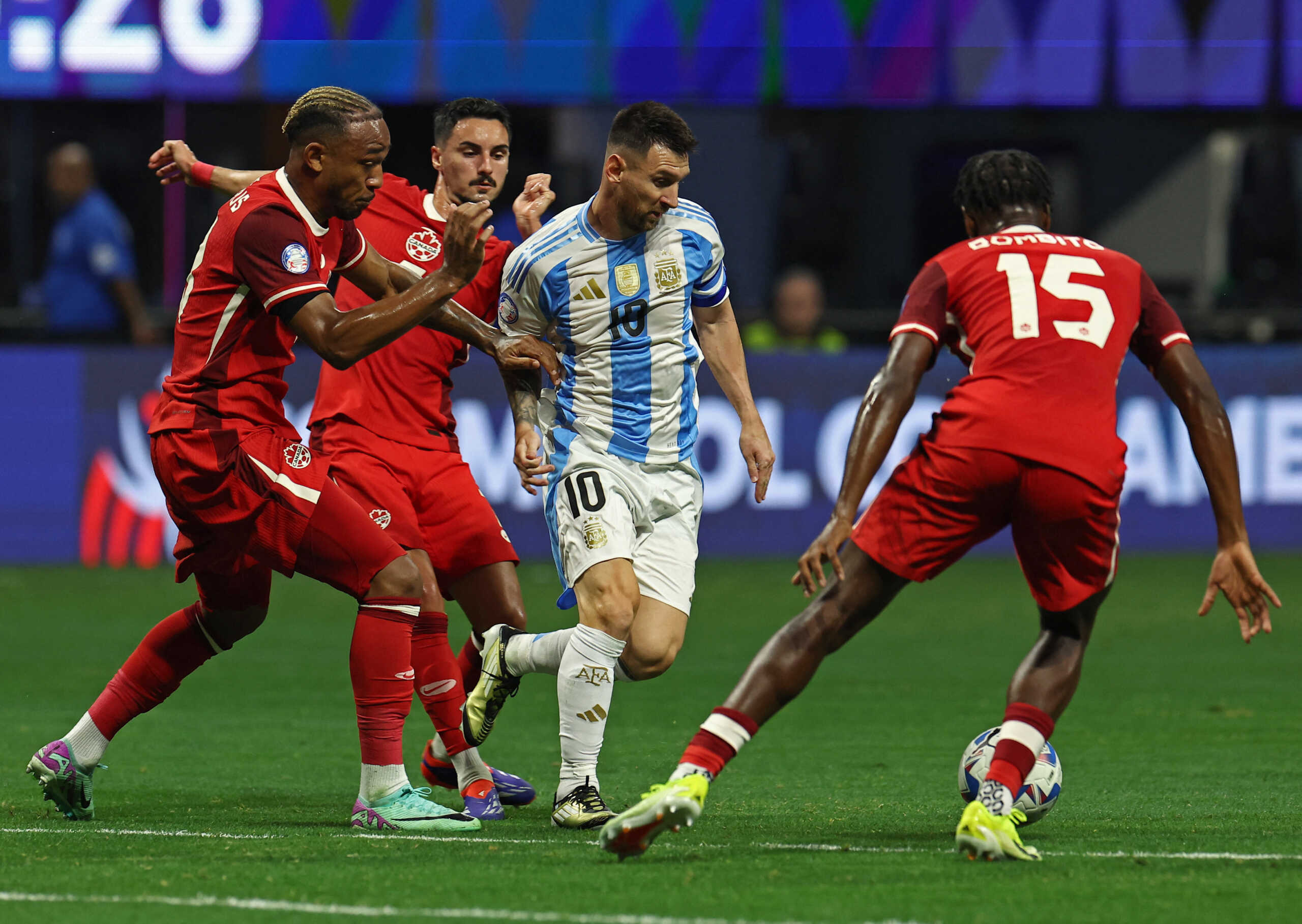 Soccer Football - Copa America 2024 - Group A - Argentina v Canada - Mercedes-Benz Stadium, Atlanta, Georgia, United States - June 20, 2024 Argentina's Lionel Messi in action with Canada's Moise Bombito REUTERS