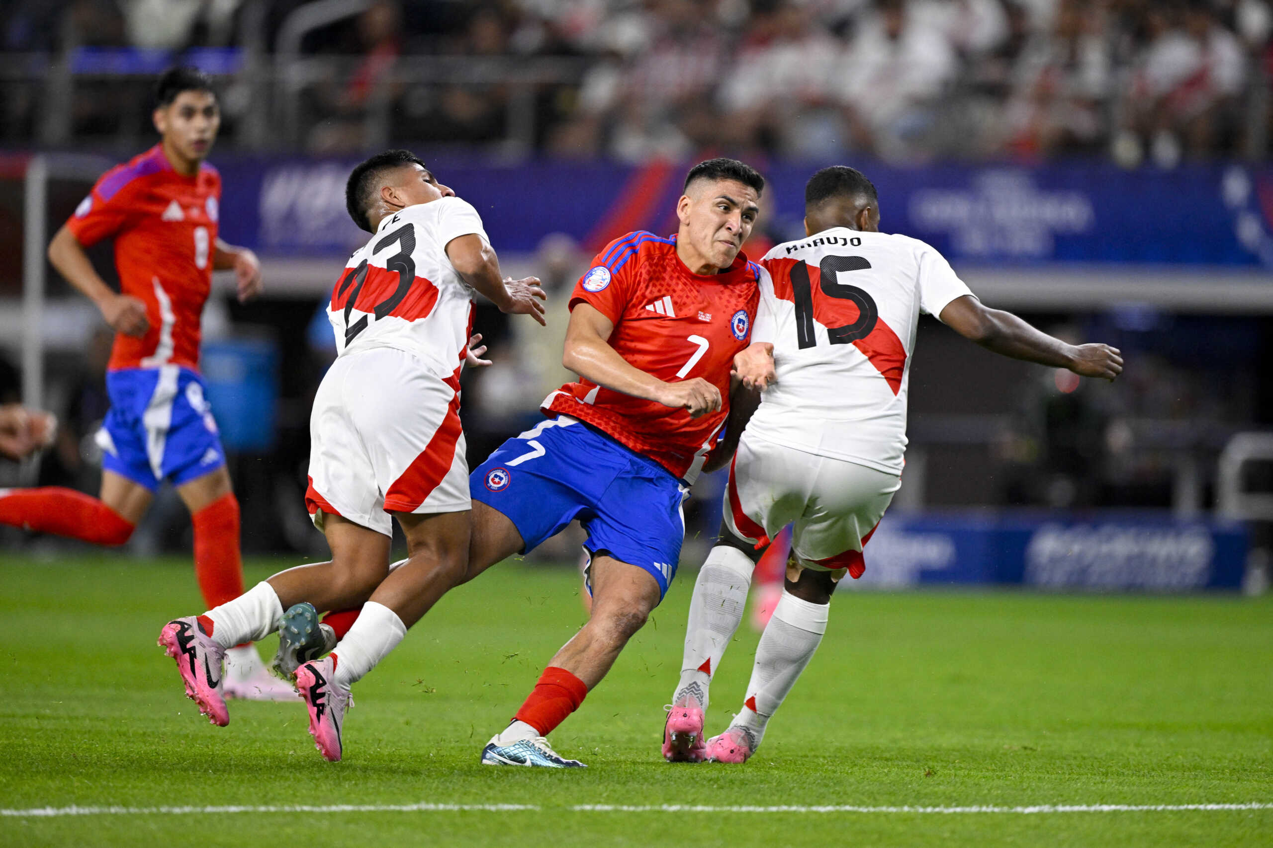 Jun 21, 2024; Arlington, TX, USA; Chile midfielder Marcelino Nunez (7) kicks the ball past Peru midfielder Piero Quispe (23) and Peru defender Miguel Araujo (15) during the second half in a 2024 Copa America match at AT&T Stadium. Mandatory Credit: Jerome Miron-USA TODAY Sports