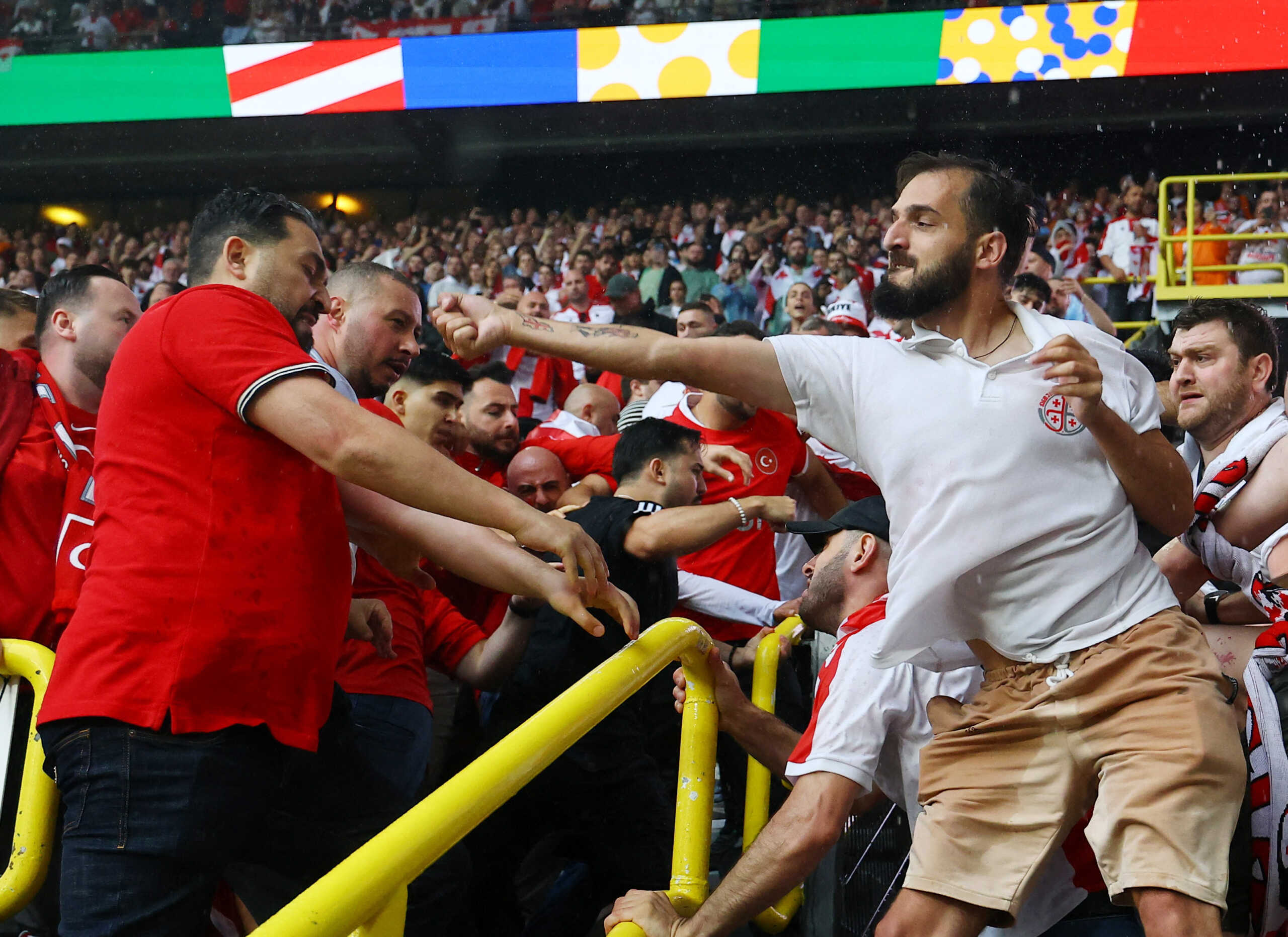 Soccer Football - Euro 2024 - Group F - Turkey v Georgia - Dortmund BVB Stadion, Dortmund, Germany - June 18, 2024 Turkey and Georgia fans clash before the match REUTERS