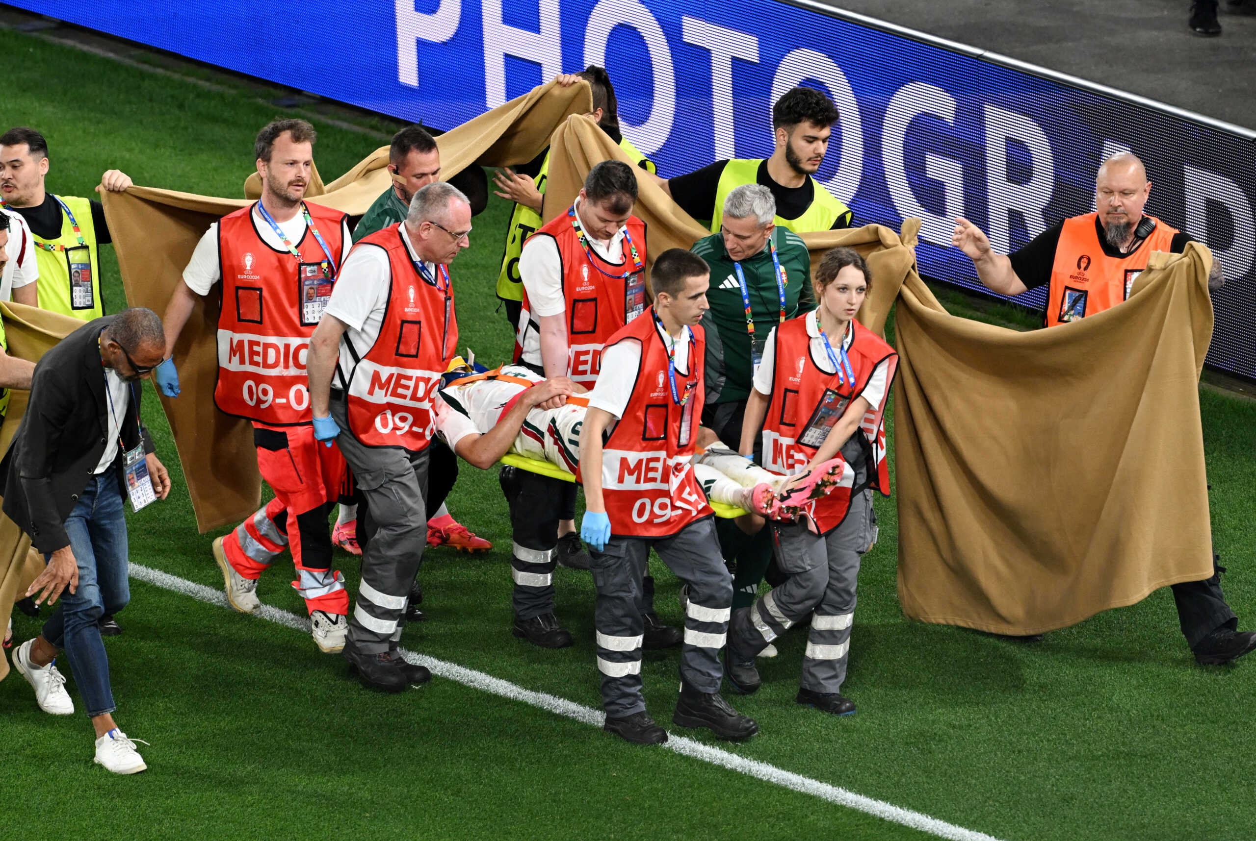 Soccer Football - Euro 2024 - Group A - Scotland v Hungary - Stuttgart Arena, Stuttgart, Germany - June 23, 2024 A sheet is put up by stewards as Hungary's Barnabas Varga is stretchered off after sustaining an injury REUTERS