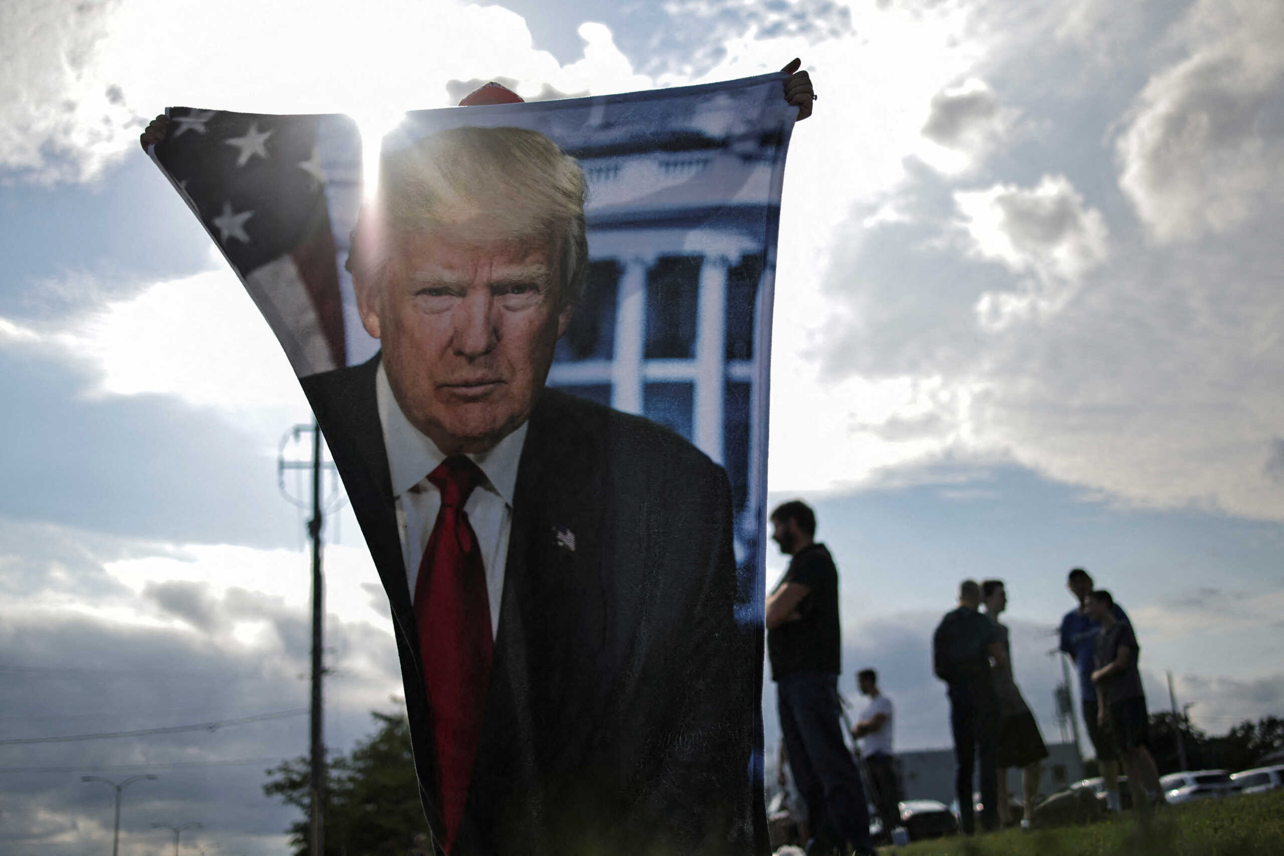 Supporters of Republican presidential candidate and former U.S. President Donald Trump wait for his arrival in Milwaukee, Wisconsin, U.S., July 14, 2024 a day after he survived an assassination attempt at a rally in Butler, Pennsylvania.  REUTERS