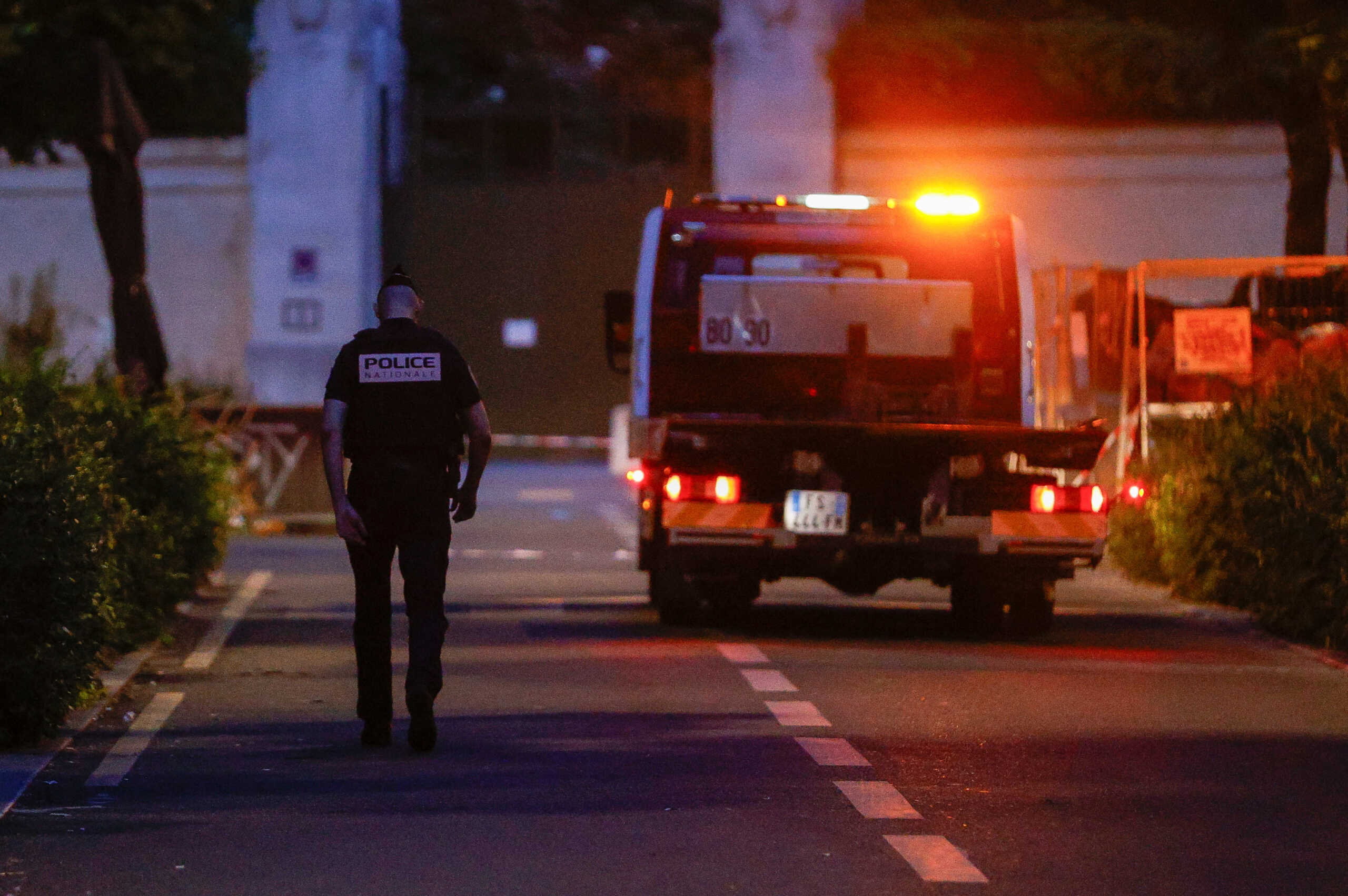 A police officer walks at the scene after a car hit people sitting on a terrace in front of a restaurant in Paris, France July 17, 2024. REUTERS