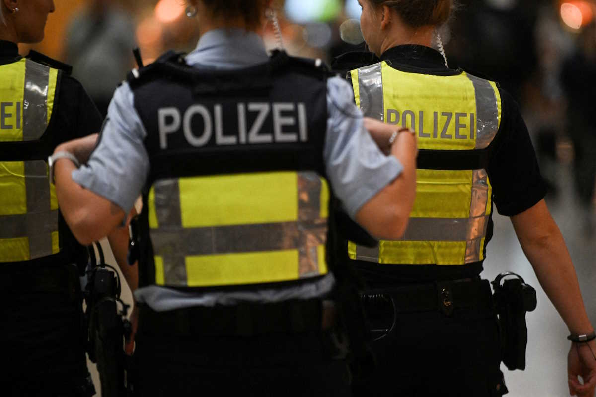 Police walk on the day activists of the "Letzte Generation" (Last Generation) protest for a change in climate policy at the Cologne-Bonn airport in Cologne, Germany July 24, 2024. REUTERS