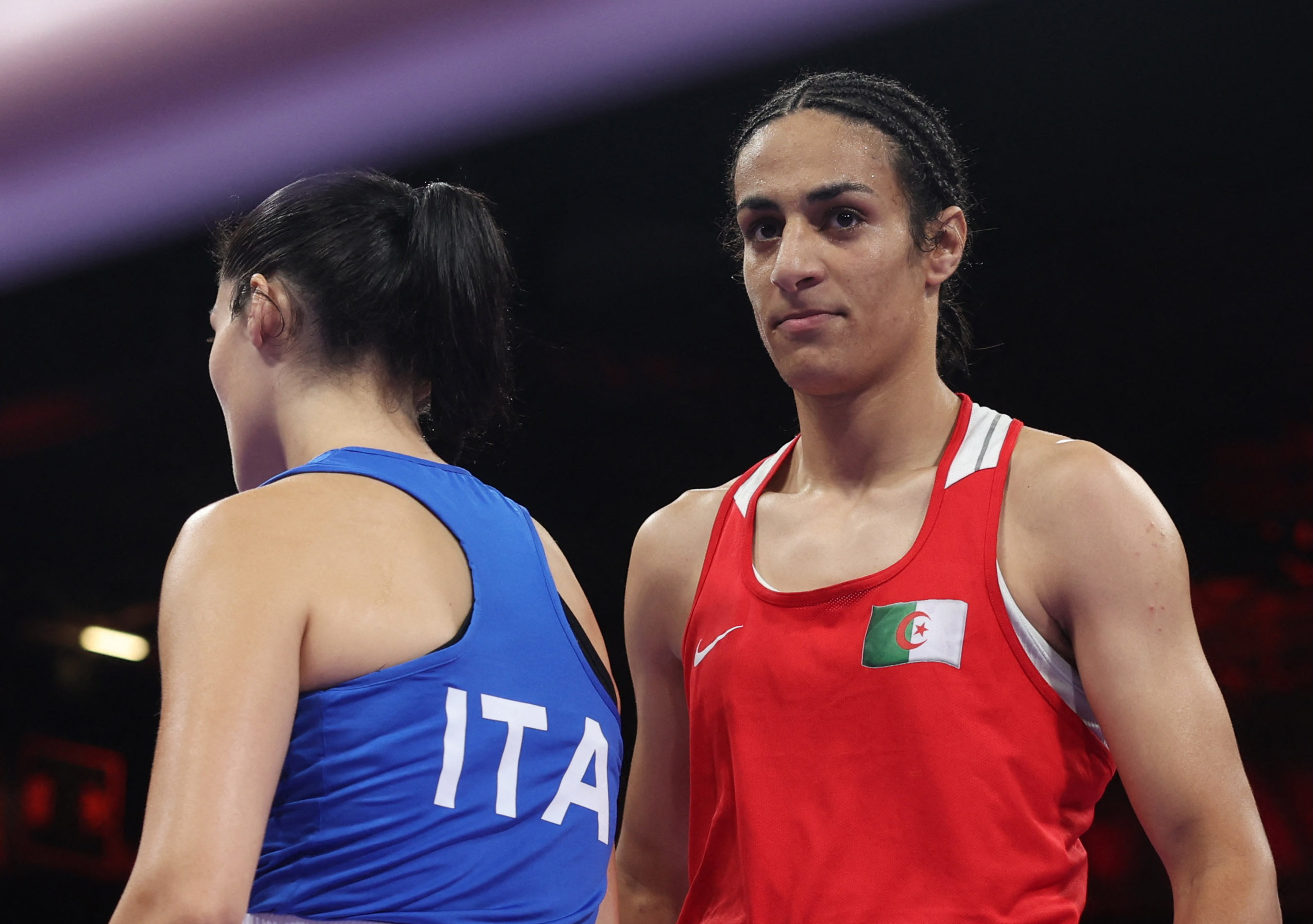 Paris 2024 Olympics - Boxing - Women's 66kg - Prelims - Round of 16 - North Paris Arena, Villepinte, France - August 01, 2024. Imane Khelif of Algeria and Angela Carini of Italy react after their fight. REUTERS