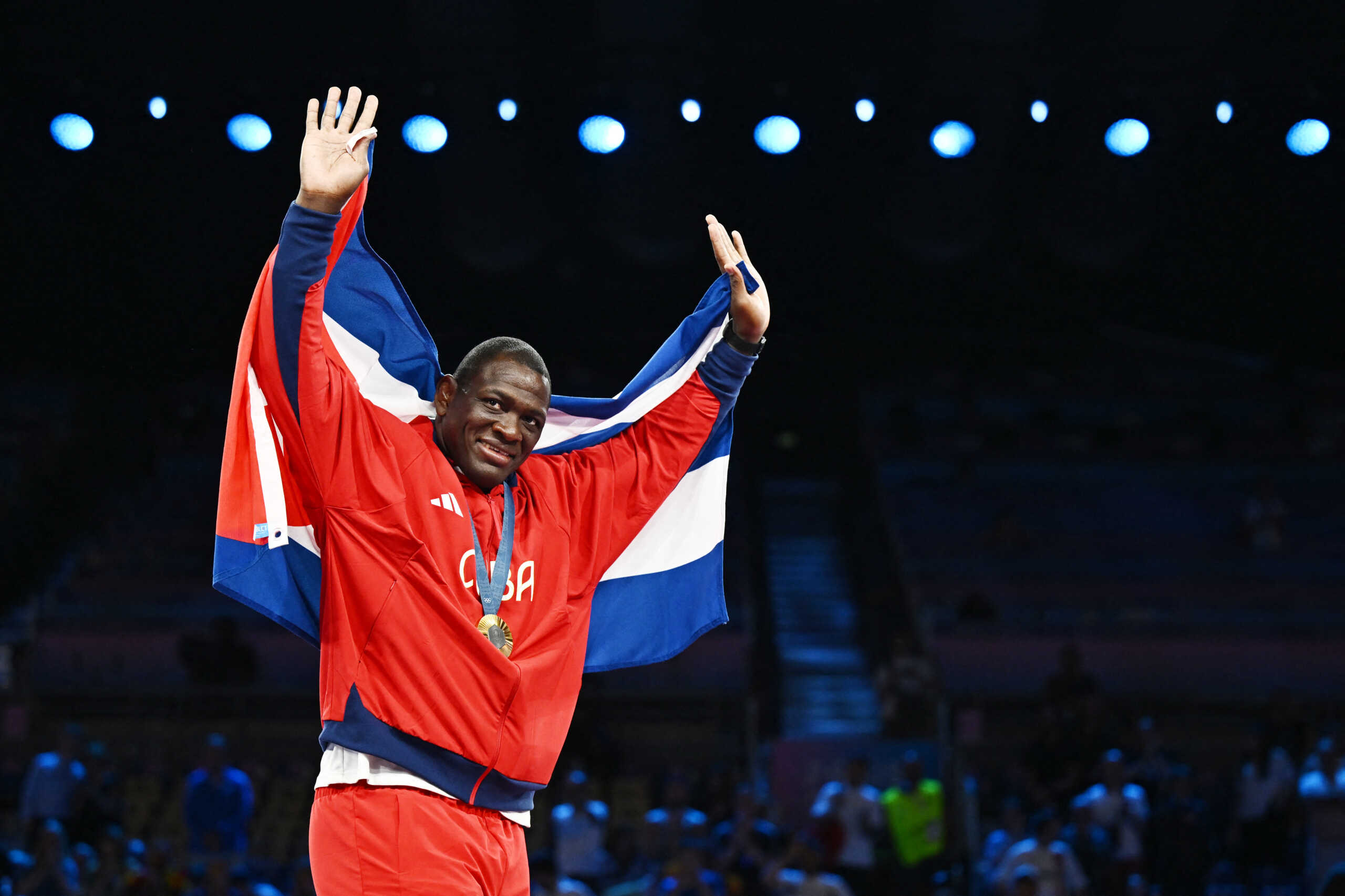 Paris 2024 Olympics - Wrestling - Men's Greco-Roman 130kg Victory Ceremony - Champ-de-Mars Arena, Paris, France - August 06, 2024. Gold medallist Mijain Lopez Nunez of Cuba celebrates during the ceremony. REUTERS