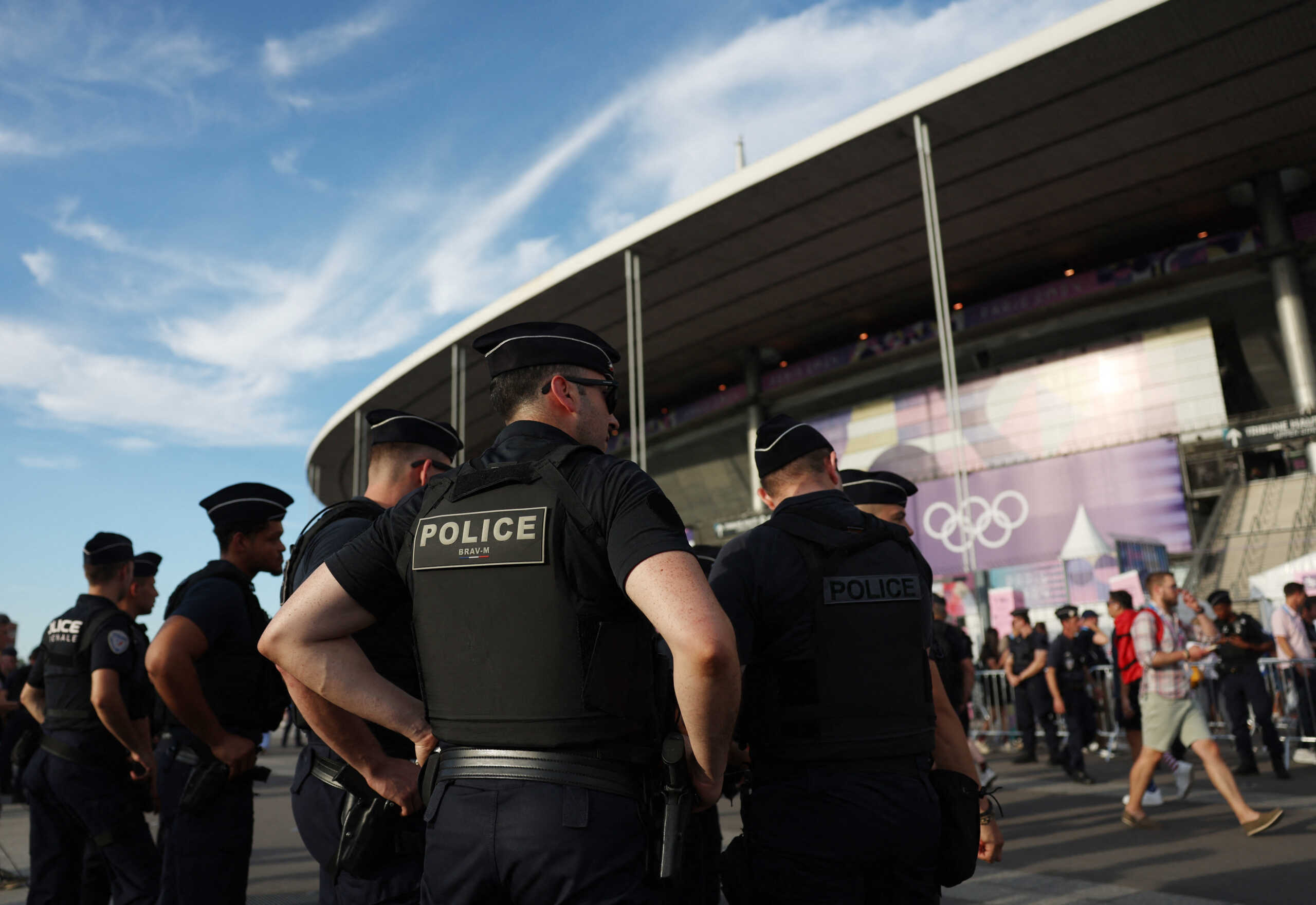 Paris 2024 Olympics - Ceremonies - Paris 2024 Closing Ceremony - Stade de France, Saint-Denis, France - August 11, 2024. General view of police officers outside the stadium before the closing ceremony. REUTERS