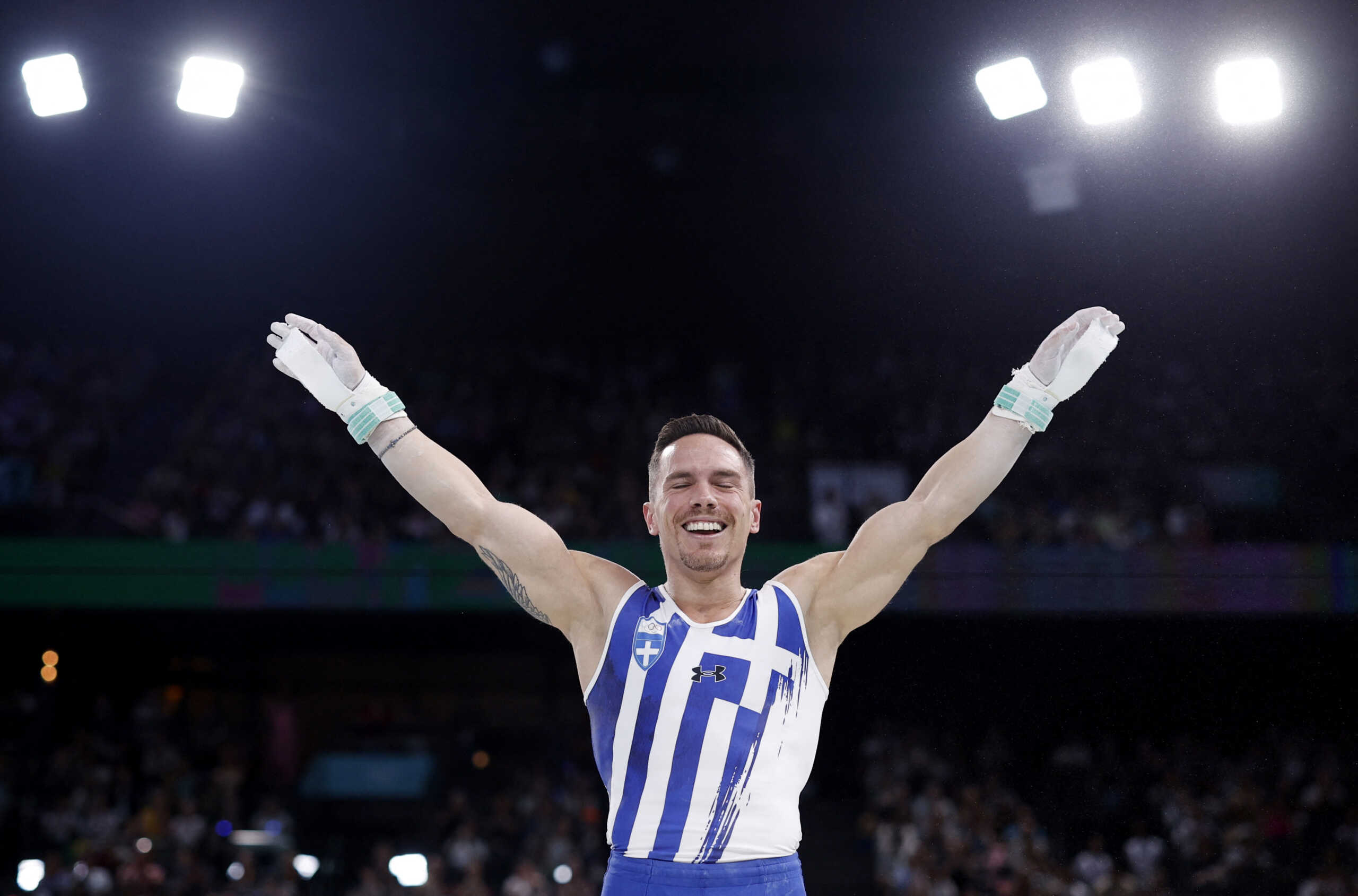 Paris 2024 Olympics - Artistic Gymnastics - Men's Rings Final - Bercy Arena, Paris, France - August 04, 2024. Eleftherios Petrounias of Greece reacts after performing on the Rings. REUTERS