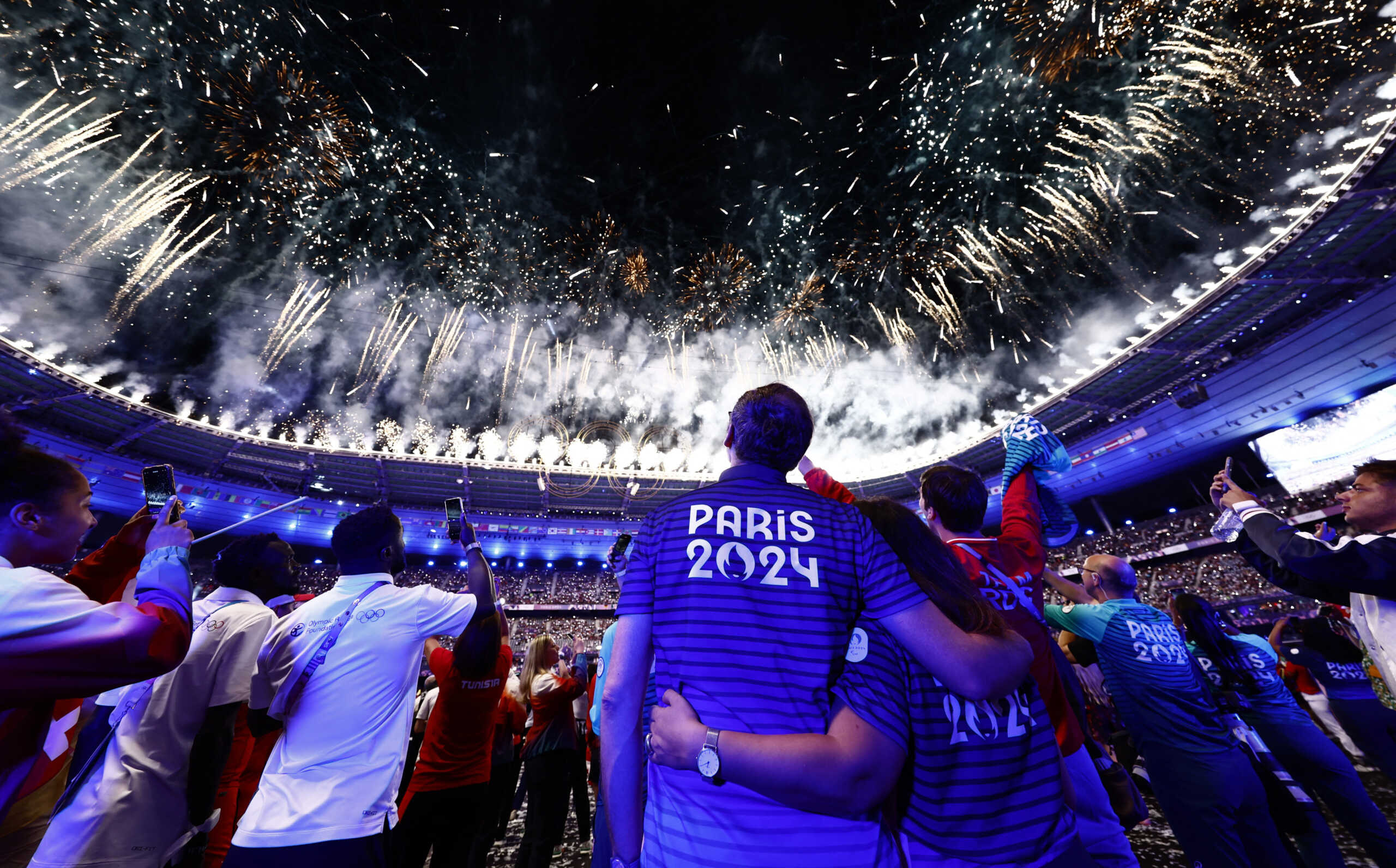 Paris 2024 Olympics - Ceremonies - Paris 2024 Closing Ceremony - Stade de France, Saint-Denis, France - August 12, 2024. athletes watch as fireworks explode during the closing ceremony REUTERS