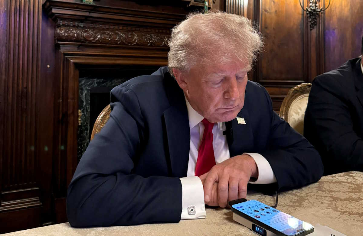 Republican presidential nominee and former U.S. President Donald Trump speaks as he participates in an interview with billionaire entrepreneur Elon Musk on the social media platform X, at Mar-a-Lago in Palm Beach, Florida, U.S., August 12, 2024 in this picture obtained from social media.  Margo Martin via X