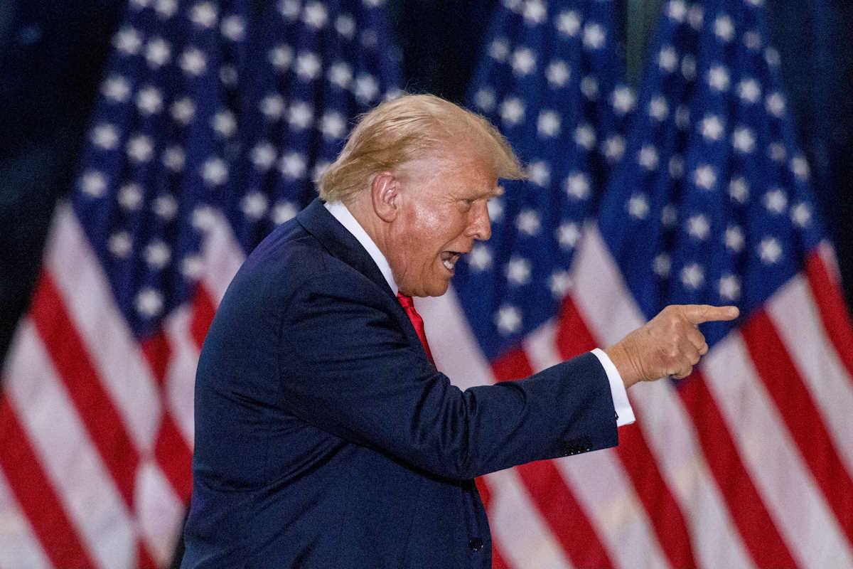 FILE PHOTO: Republican presidential nominee and former U.S. President Donald Trump gestures during a rally with his vice presidential running mate U.S. Senator JD Vance in St. Cloud, Minnesota, U.S., July 27, 2024. REUTERS