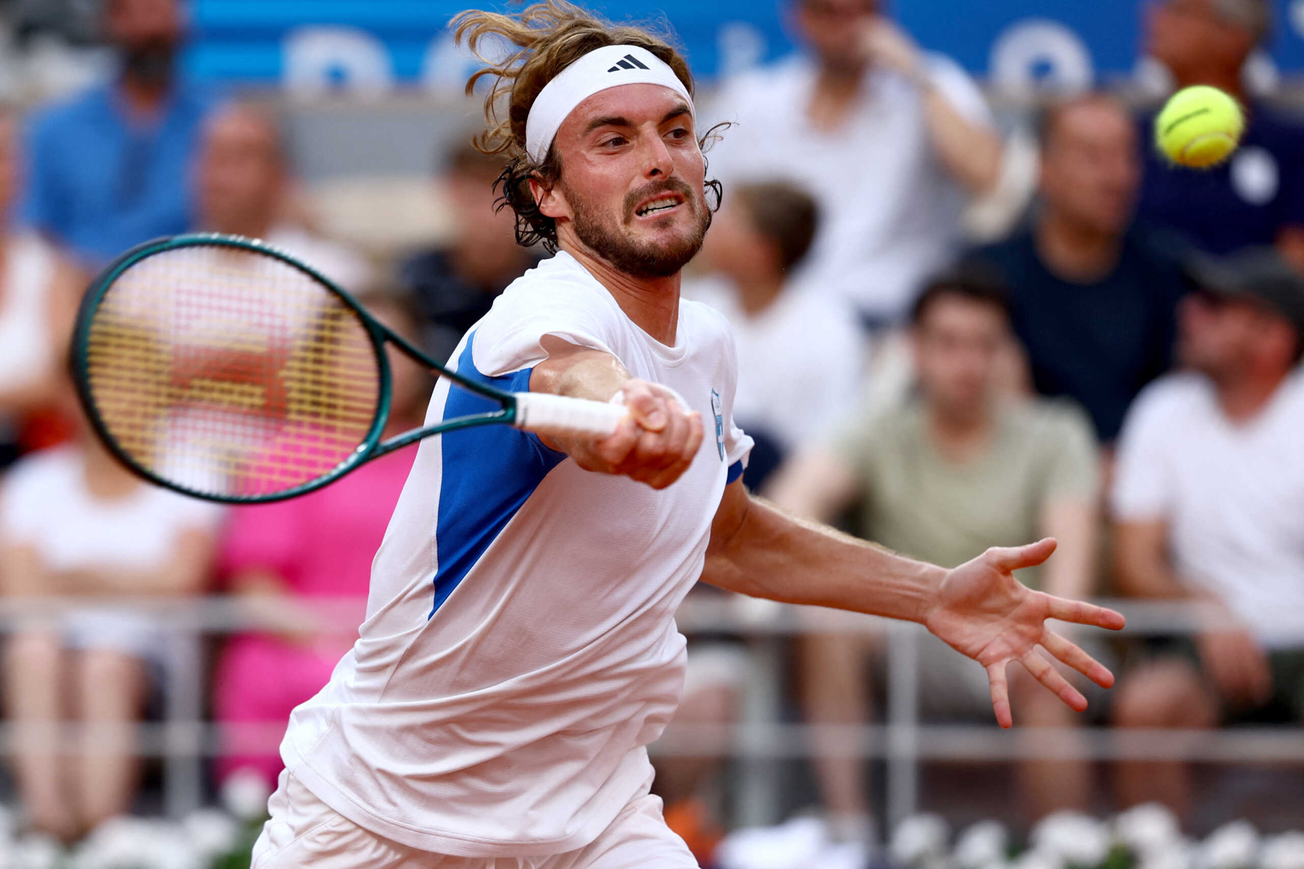 Paris 2024 Olympics - Tennis - Men's Singles Quarterfinals - Roland-Garros Stadium, Paris, France - August 01, 2024. Stefanos Tsitsipas of Greece in action during his match against Novak Djokovic of Serbia. REUTERS