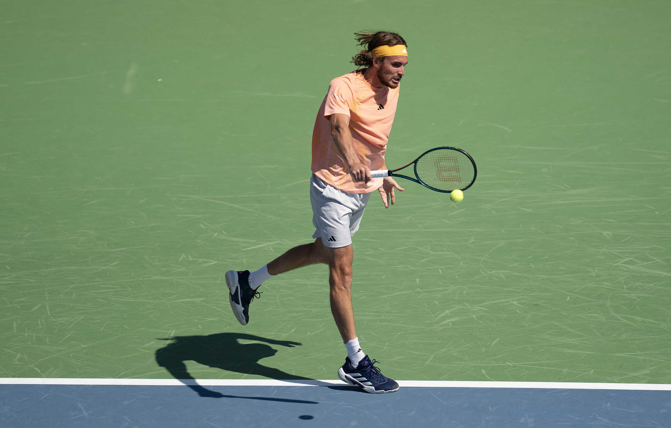 Aug 14, 2024; Cincinnati, OH, USA; Stefanos Tsitsipas of Greece returns a shot against Jan-Lennard Struff of Germany on day three of the Cincinnati Open. Mandatory Credit: Susan Mullane-USA TODAY Sports