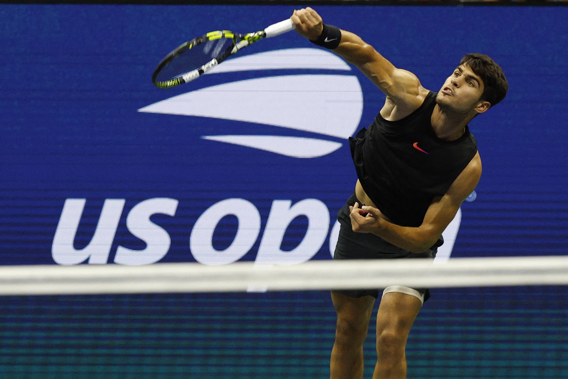 Aug 29, 2024; Flushing, NY, USA; Carlos Alcaraz (ESP) serves against Botic van De Zandschlup (NED)(not pictured) in a men's singles match on day four of the 2024 U.S. Open tennis tournament at Billie Jean King National Tennis Center. Mandatory Credit: Geoff Burke-USA TODAY Sports