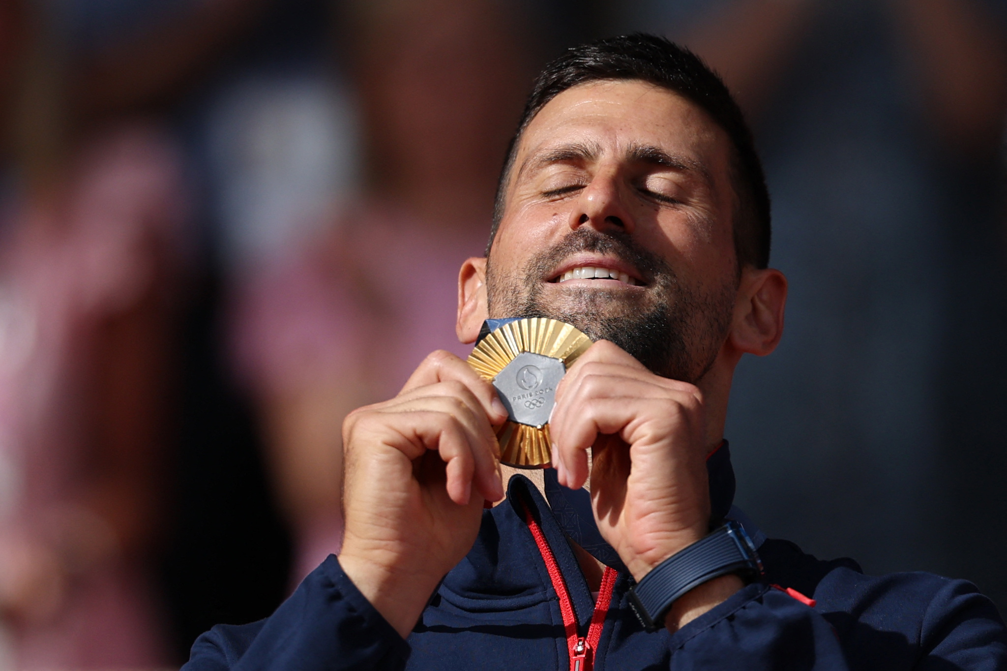 Paris 2024 Olympics - Tennis - Men's Singles Victory Ceremony - Roland-Garros Stadium, Paris, France - August 04, 2024. Gold medallist Novak Djokovic of Serbia holds his medal. REUTERS