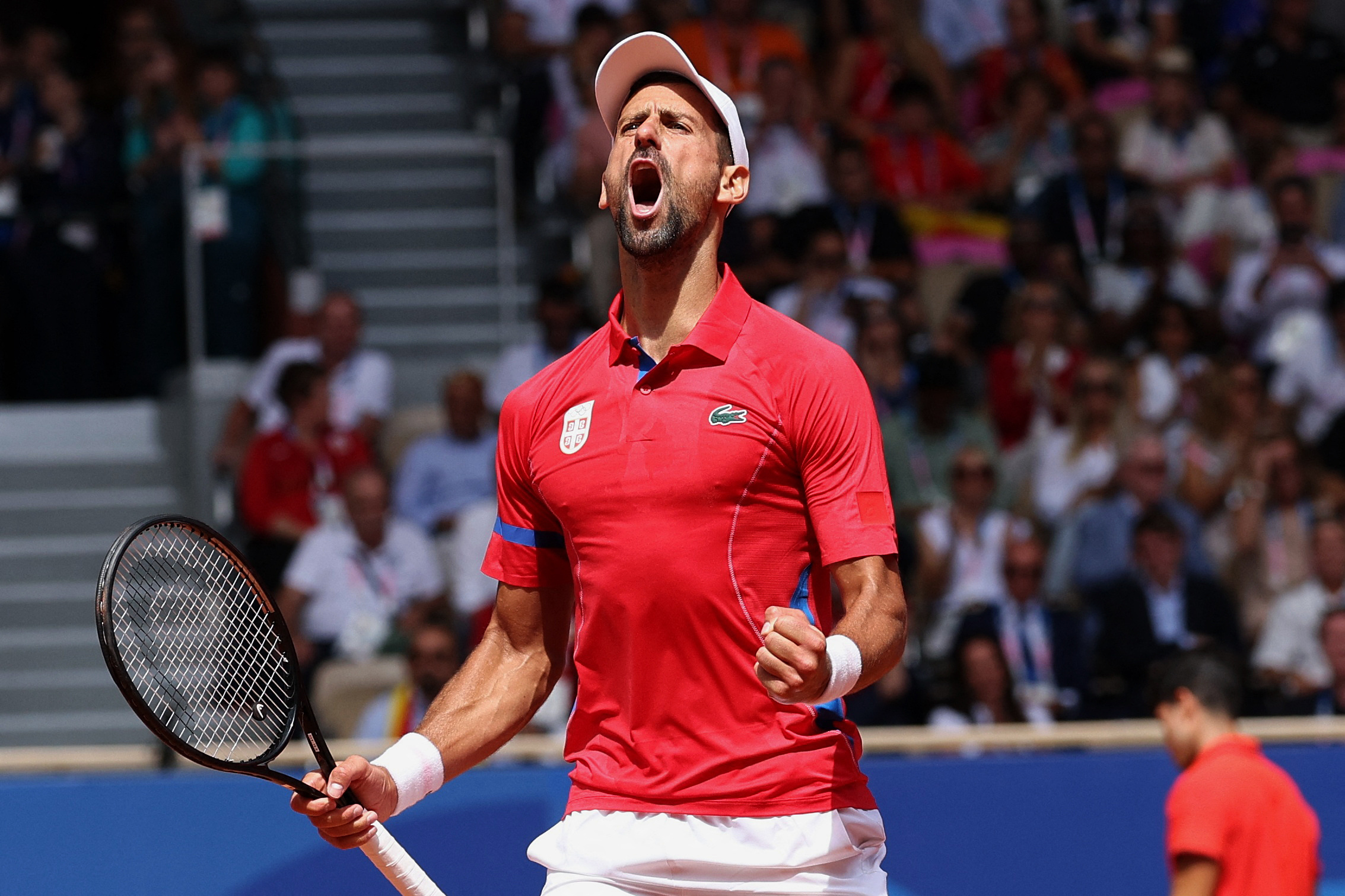 Paris 2024 Olympics - Tennis - Men's Singles Gold Medal Match - Roland-Garros Stadium, Paris, France - August 04, 2024. Novak Djokovic of Serbia reacts during his match against Carlos Alcaraz of Spain. REUTERS