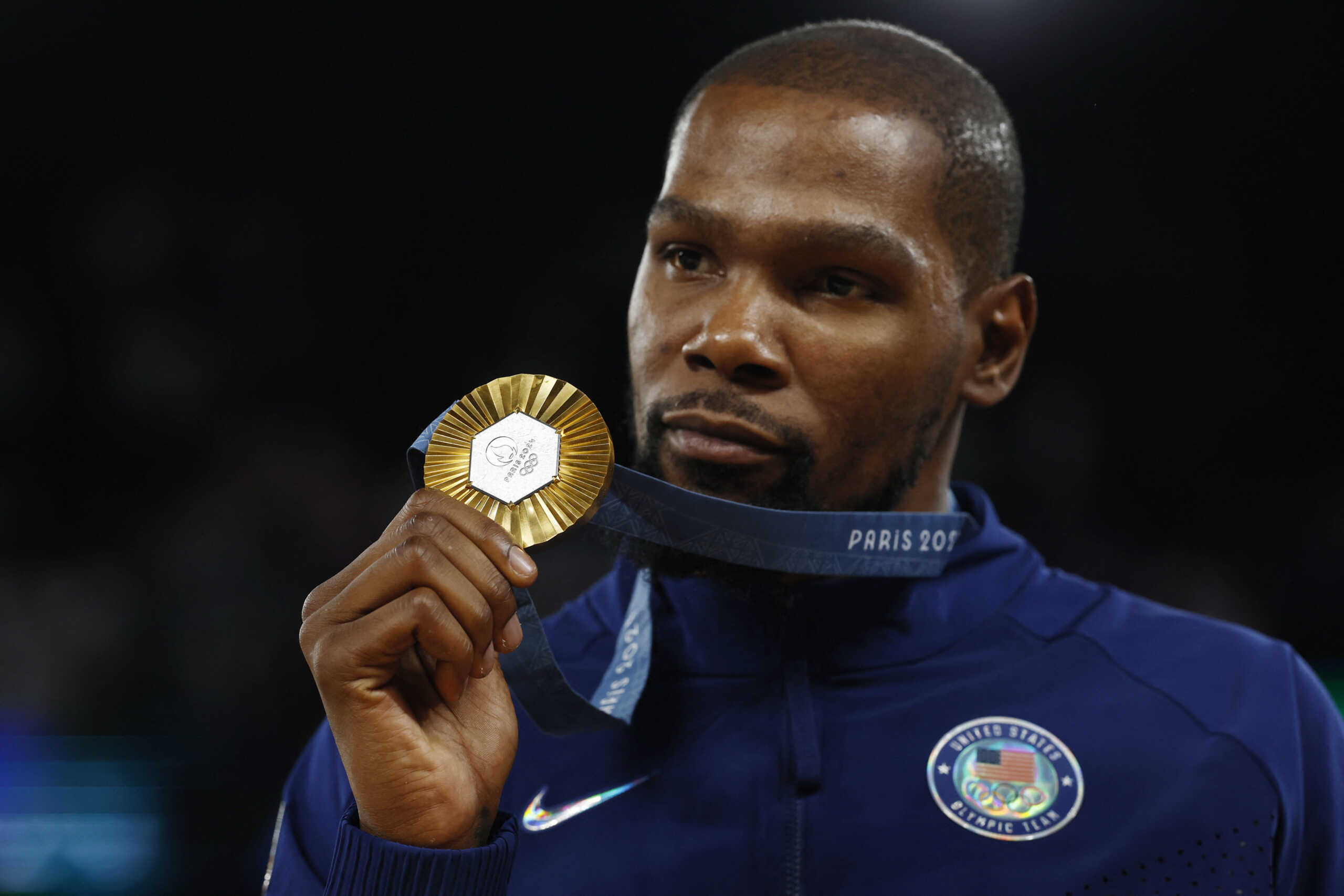 Paris 2024 Olympics - Basketball - Men's Victory Ceremony - Bercy Arena, Paris, France - August 10, 2024. Gold medallist Kevin Durant of United States poses with his medal. REUTERS