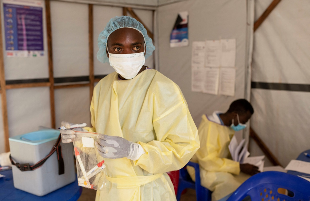 Christian Musema, a laboratory nurse, verifies samples taken from a child declared a suspected case of monkeypox virus that sparks off a painful rash, enlarged lymph nodes and fever; and recovered, collects water at the the treatment centre in Munigi, following Mpox cases in Nyiragongo territory near Goma, North Kivu province, Democratic Republic of the Congo July 19, 2024. REUTERS