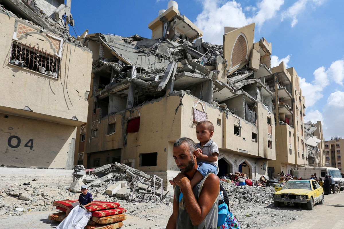 Displaced Palestinians make their way as they flee Hamad City following an Israeli evacuation order, amid Israel-Hamas conflict, in Khan Younis in the southern Gaza Strip August 11, 2024. REUTERS