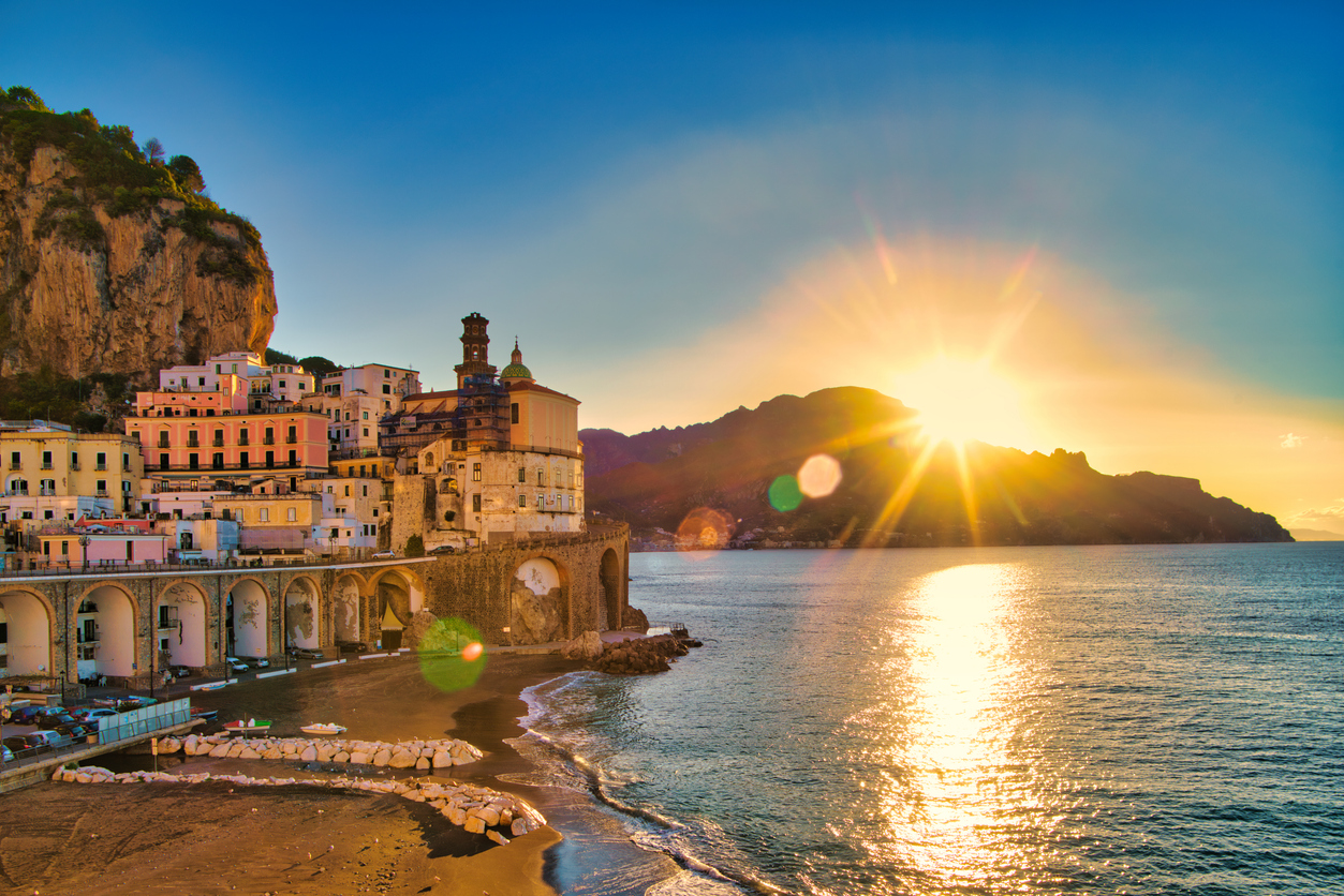 Sunrise over the famous village of Atrani on the Amalfi coast. Many of the small villages along the Amalfi coastline are hundreds of meters above sea level, because of the geographical reasons. The Amalfi coast is a stretch of coastline on the northern coast of the Salerno Gulf on the Tyrrhenian Sea, located in the Province of Salerno of southern Italy. The Amalfi Coast is a popular tourist destination for the region and Italy as a whole, attracting thousands of tourists annually. In 1997, the Amalfi Coast was listed as a UNESCO World Heritage Site.