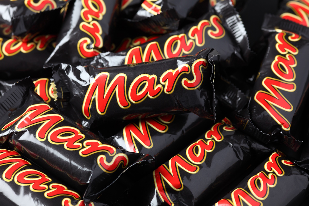 "Tambov, Russian Federation - September 01, 2012: Mars minis candy bars heap. Full Frame. Mars bar is a chocolate bar manufactured by Mars, Incorporated."