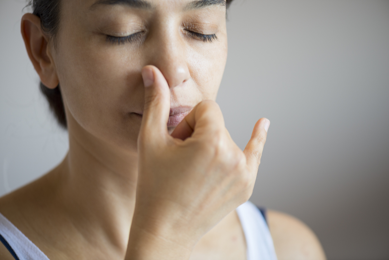 Young attractive woman doing breath therapy.