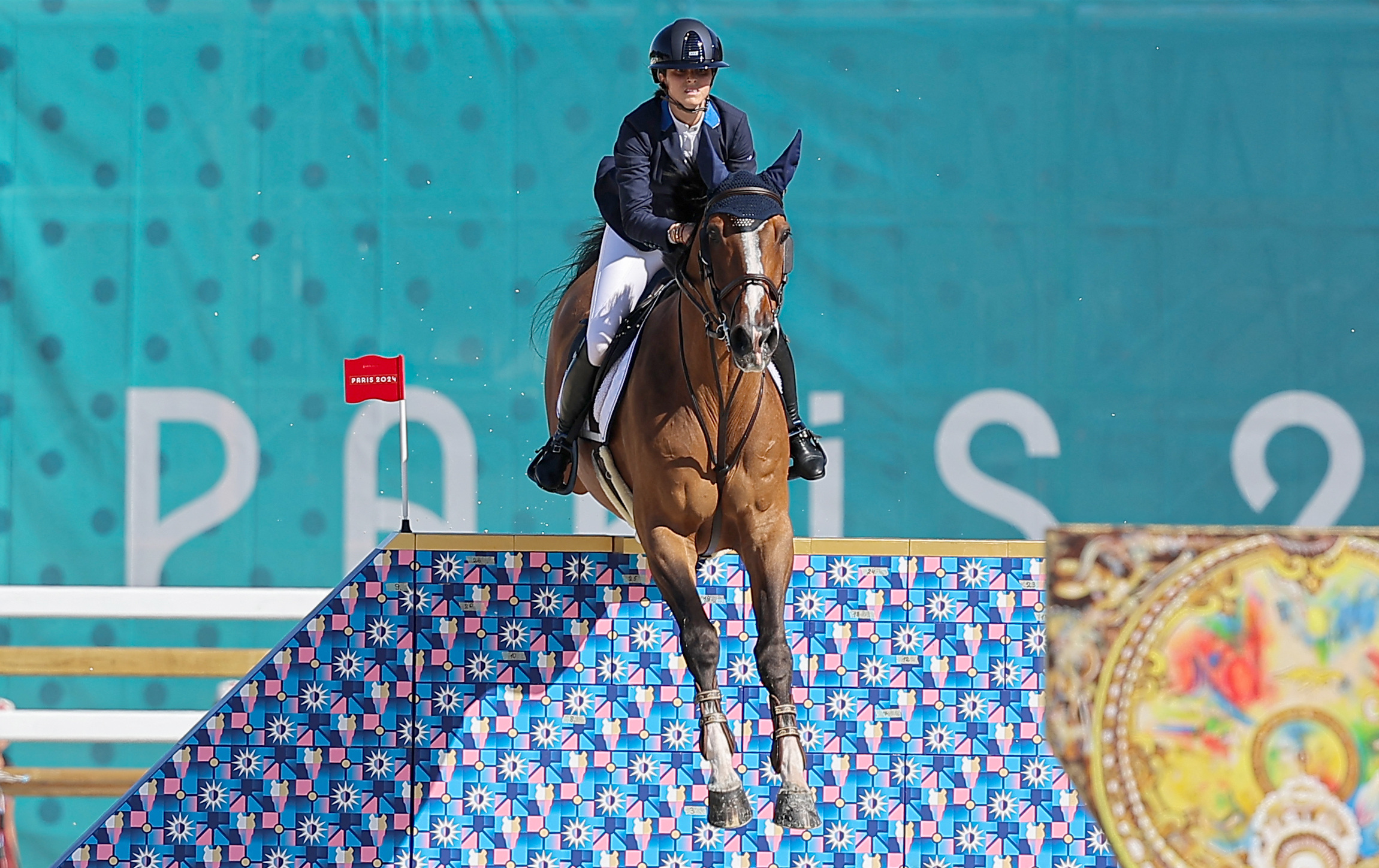 Paris 2024 Olympics - Equestrian - Jumping Individual Qualifier - Chateau de Versailles, Versailles, France - August 05, 2024. Ioli Mytilineou of Greece riding L'Artiste de Toxandra in action REUTERS