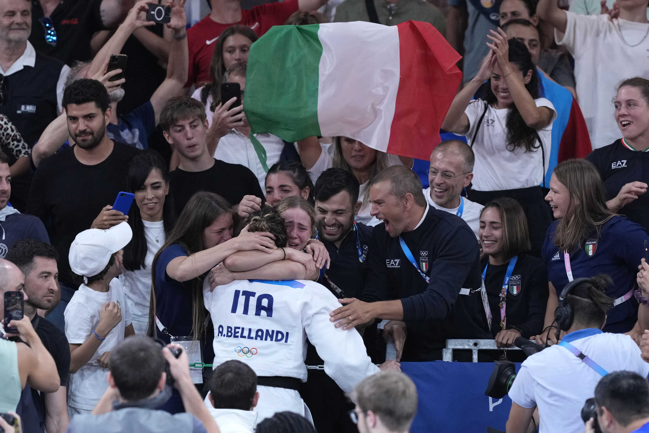 Italy's Alice Bellandi celebrates after defeating Israel's Inbar Lanir during their women's -78 kg final match in the team judo competition, at Champ-de-Mars Arena, during the 2024 Summer Olympics, Thursday, Aug. 1, 2024, in Paris, France. (AP Photo