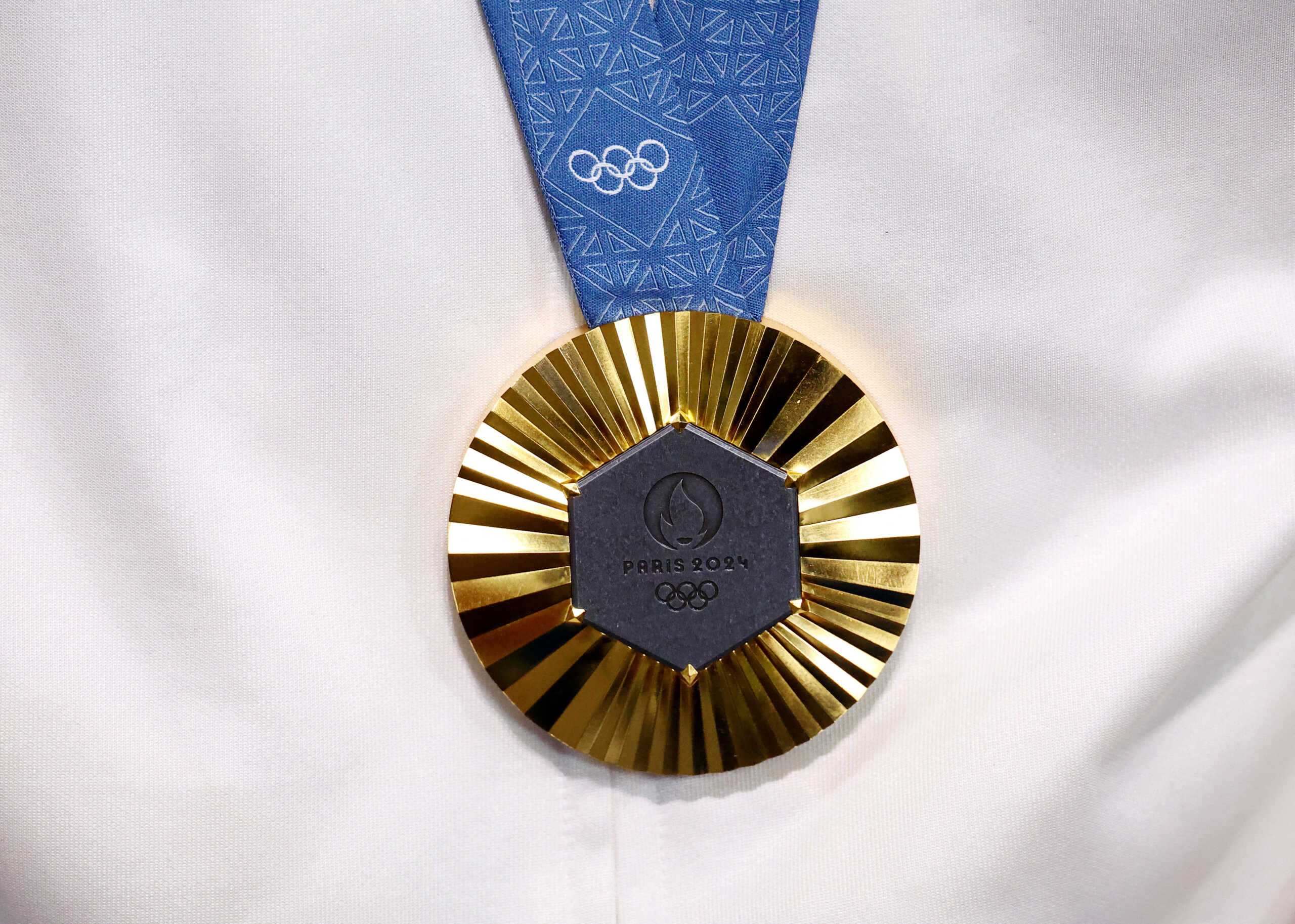 FILE PHOTO: Paris 2024 Olympics - Swimming - Men's 200m Breaststroke Victory Ceremony - Paris La Defense Arena, Nanterre, France - July 31, 2024. The gold medal worn by Leon Marchand of France on the podium after he wins the Men's 200m Breaststroke REUTERS