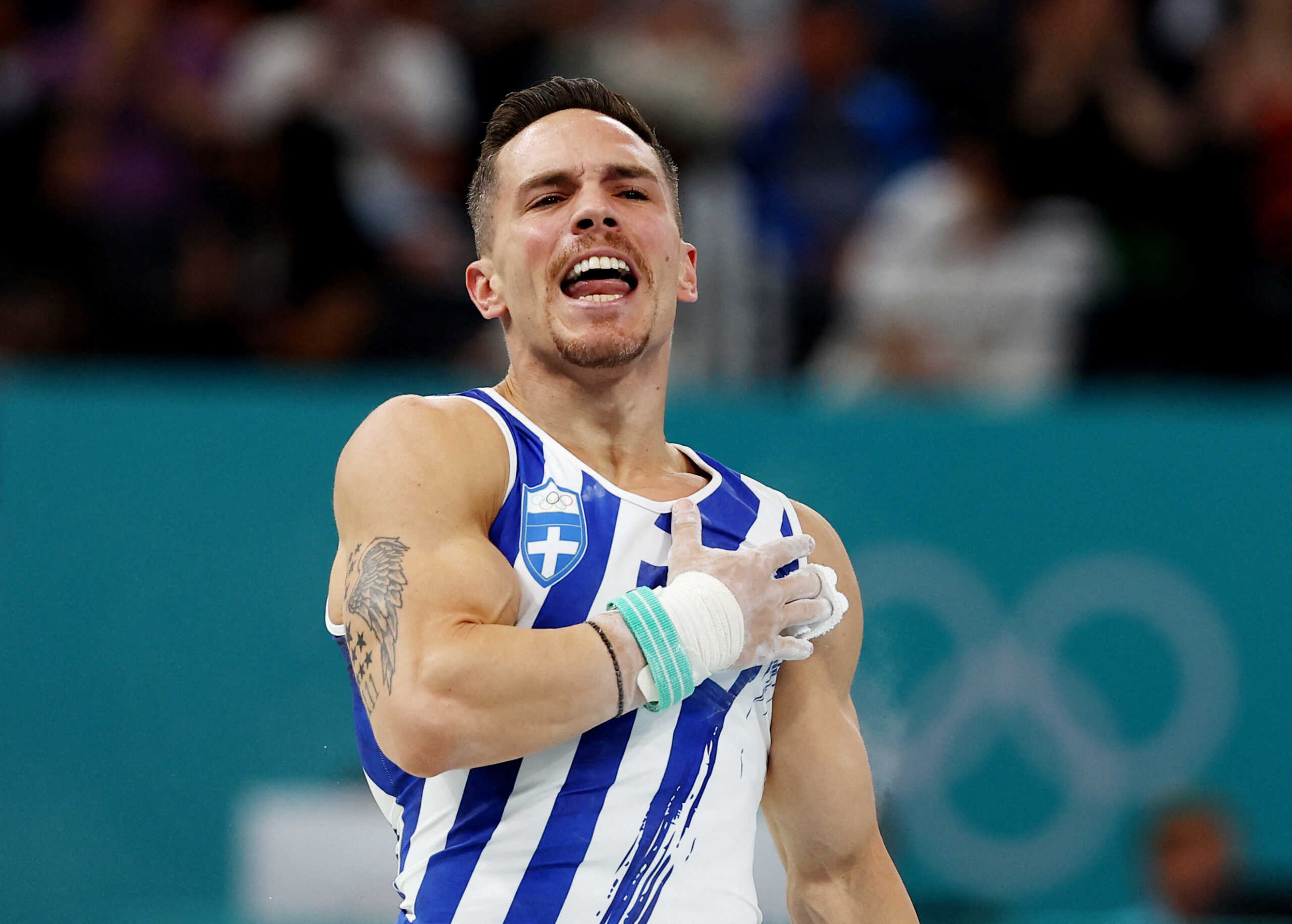 Paris 2024 Olympics - Artistic Gymnastics - Men's Rings Final - Bercy Arena, Paris, France - August 04, 2024. Eleftherios Petrounias of Greece reacts after his performance. REUTERS