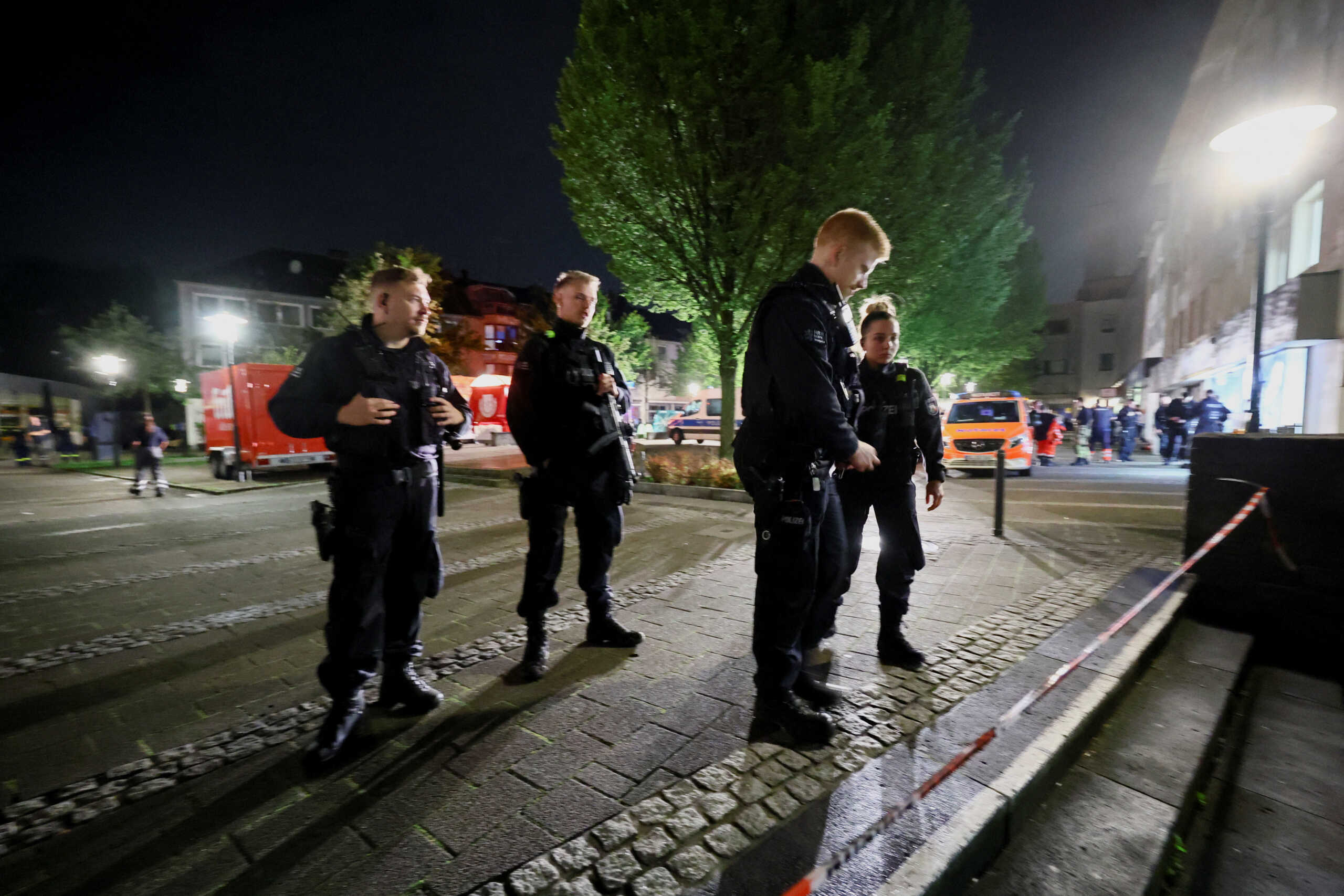 Police officers stand guard following an incident in which several individuals were killed on Friday night when a man randomly stabbed passers-by with a knife at a city festival, in Solingen, Germany, August 24, 2024. REUTERS