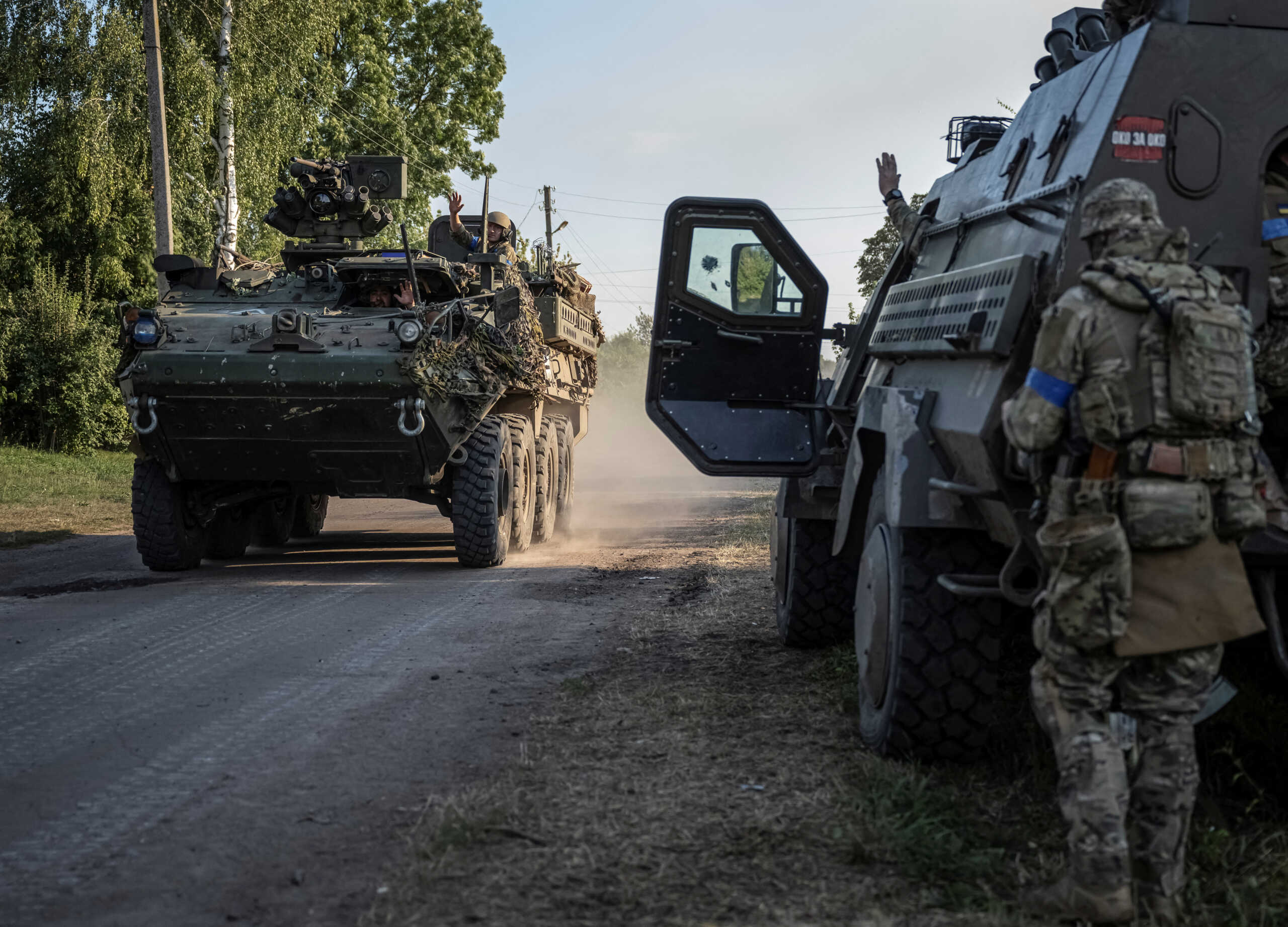 Ukrainian servicemen ride an armoured personnel carrier, amid Russia's attack on Ukraine, near the Russian border in Sumy region, Ukraine August 16, 2024. REUTERS