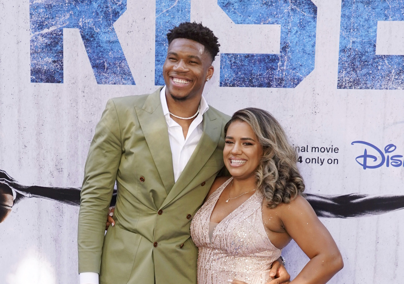 NBA basketball player Giannis Antetokounmpo poses with his wife Mariah as his son Liam walks the carpet at the premiere of the Disney+ film "Rise," Wednesday, June 22, 2022, at Walt Disney Studios in Burbank, Calif. The film is based on the story of Antetokounmpo and his family, who emigrated from Nigeria to Greece before Giannis and two of his brothers found success in the National Basketball Association. (AP Photo