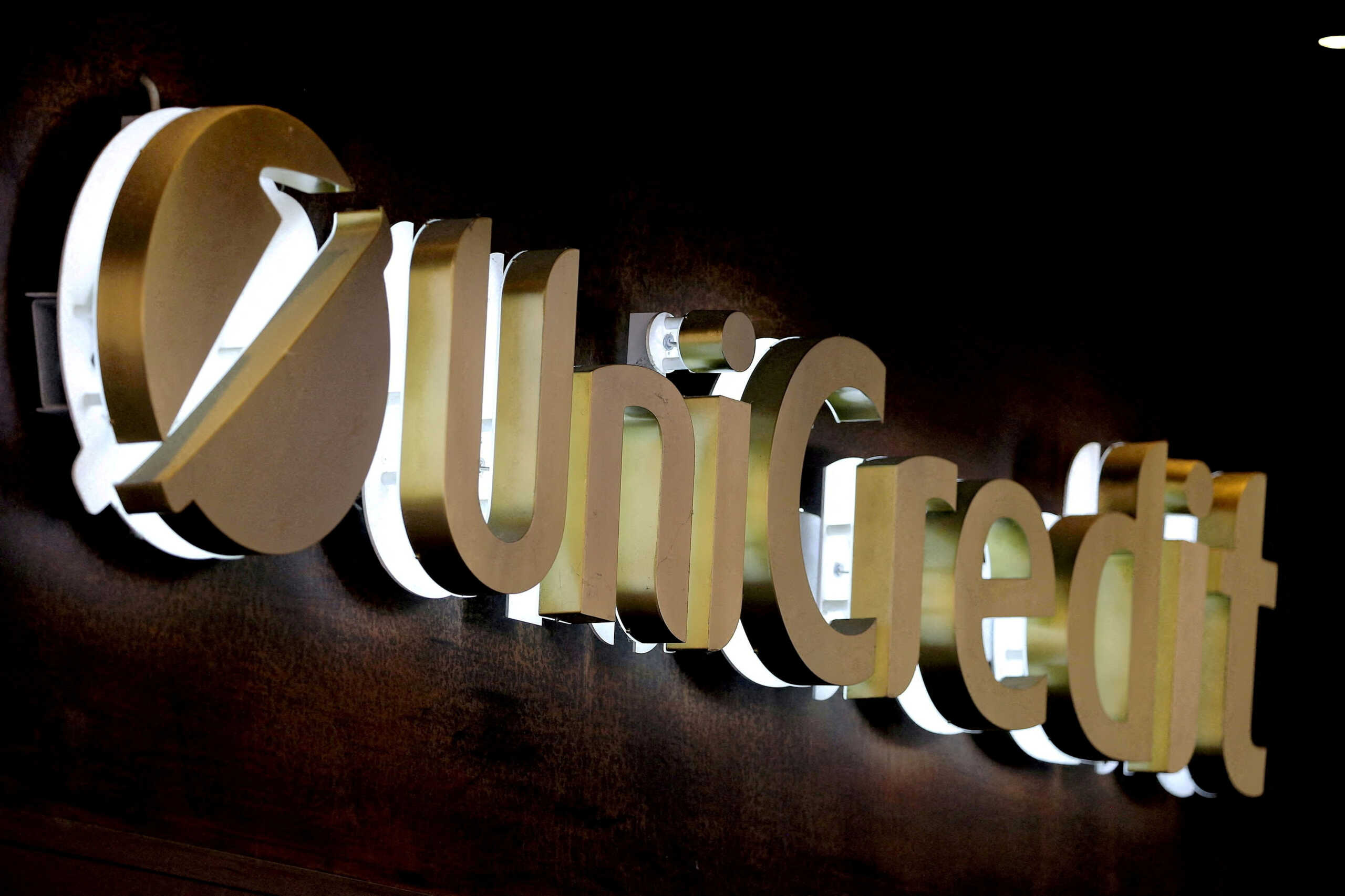 FILE PHOTO: The UniCredit bank logo in the old city centre of Siena, Italy,  June 29, 2017. REUTERS