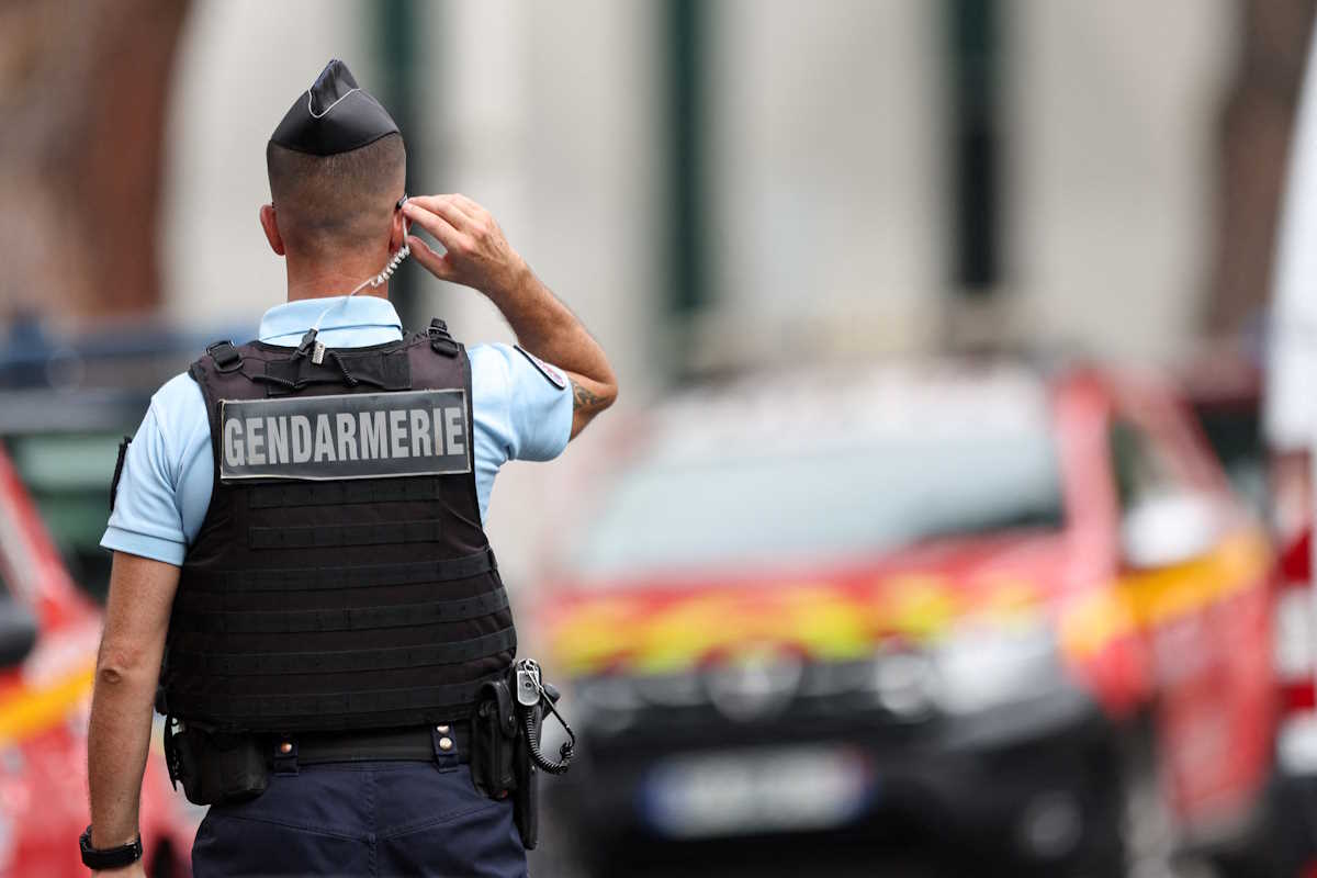 A Gendarmerie officer stands guard after cars were set on fire in front of the city's synagogue, in La Grande-Motte, France, August 24, 2024. REUTERS