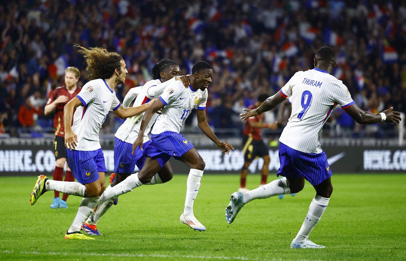 Soccer Football - Nations League - League A - Group 2 - France v Belgium - Groupama Stadium, Lyon, France - September 9, 2024 France's Ousmane Dembele celebrates scoring their second goal with teammates REUTERS