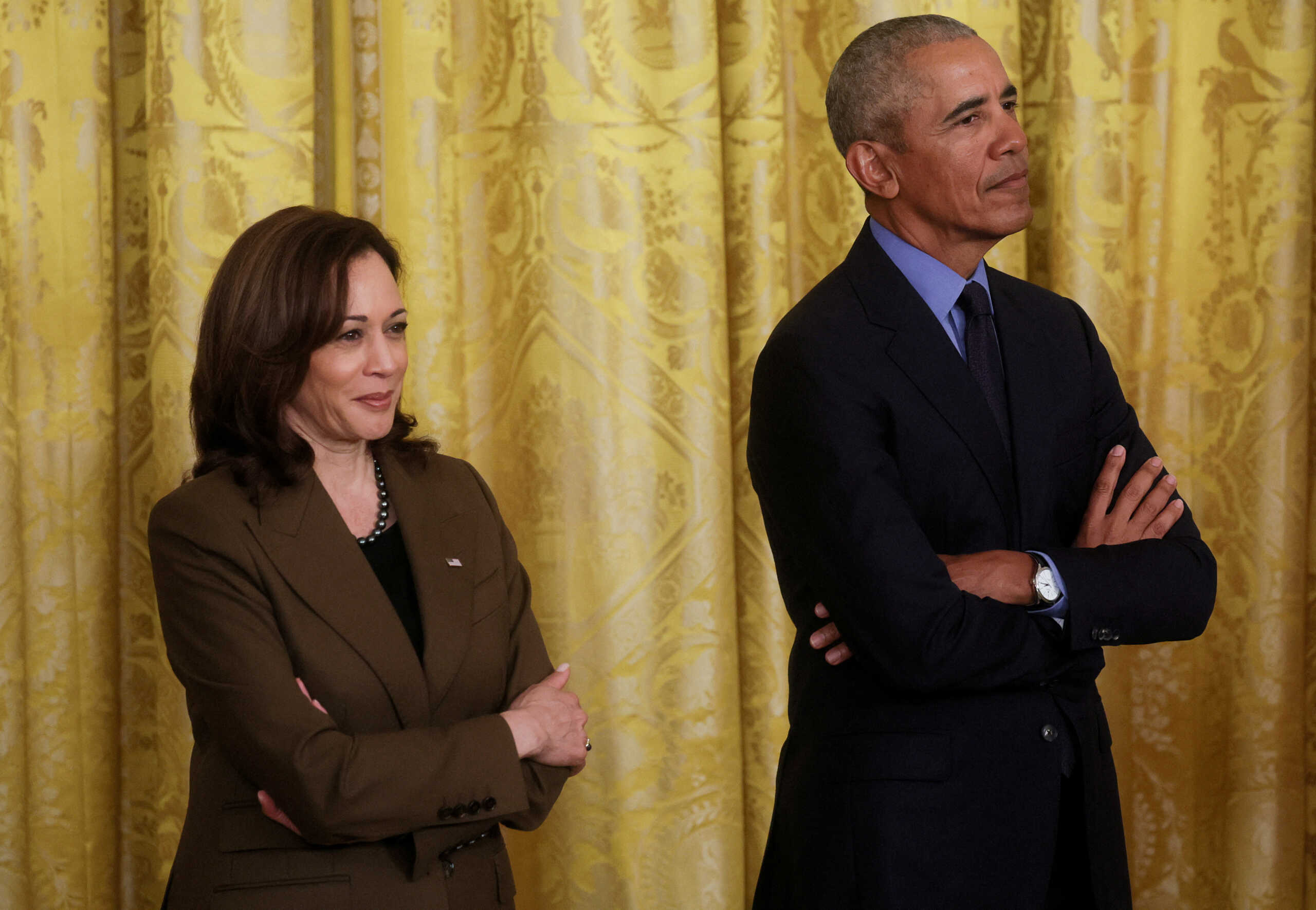 FILE PHOTO: U.S. Vice President Kamala Harris stands with former President Barack Obama during an event hosted by U.S. Presdent Joe Biden on the Affordable Care Act, Obama's top legislative accomplishment, in the East Room at the White House in Washington, U.S., April 5, 2022. REUTERS