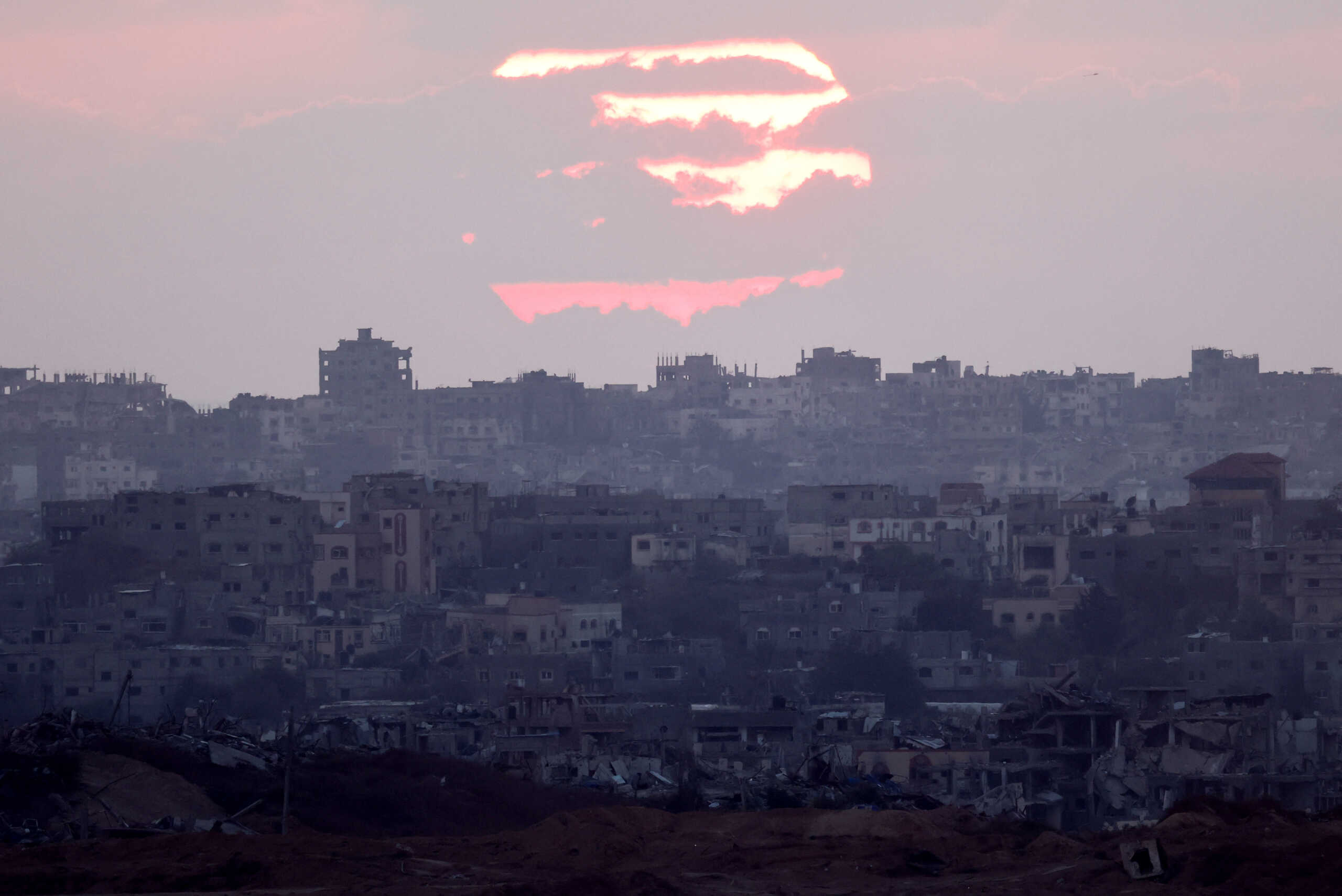 A view of Gaza during sunset, amid the Israel-Hamas conflict, near the Israel-Gaza border, as seen from Israel, September 5, 2024. REUTERS