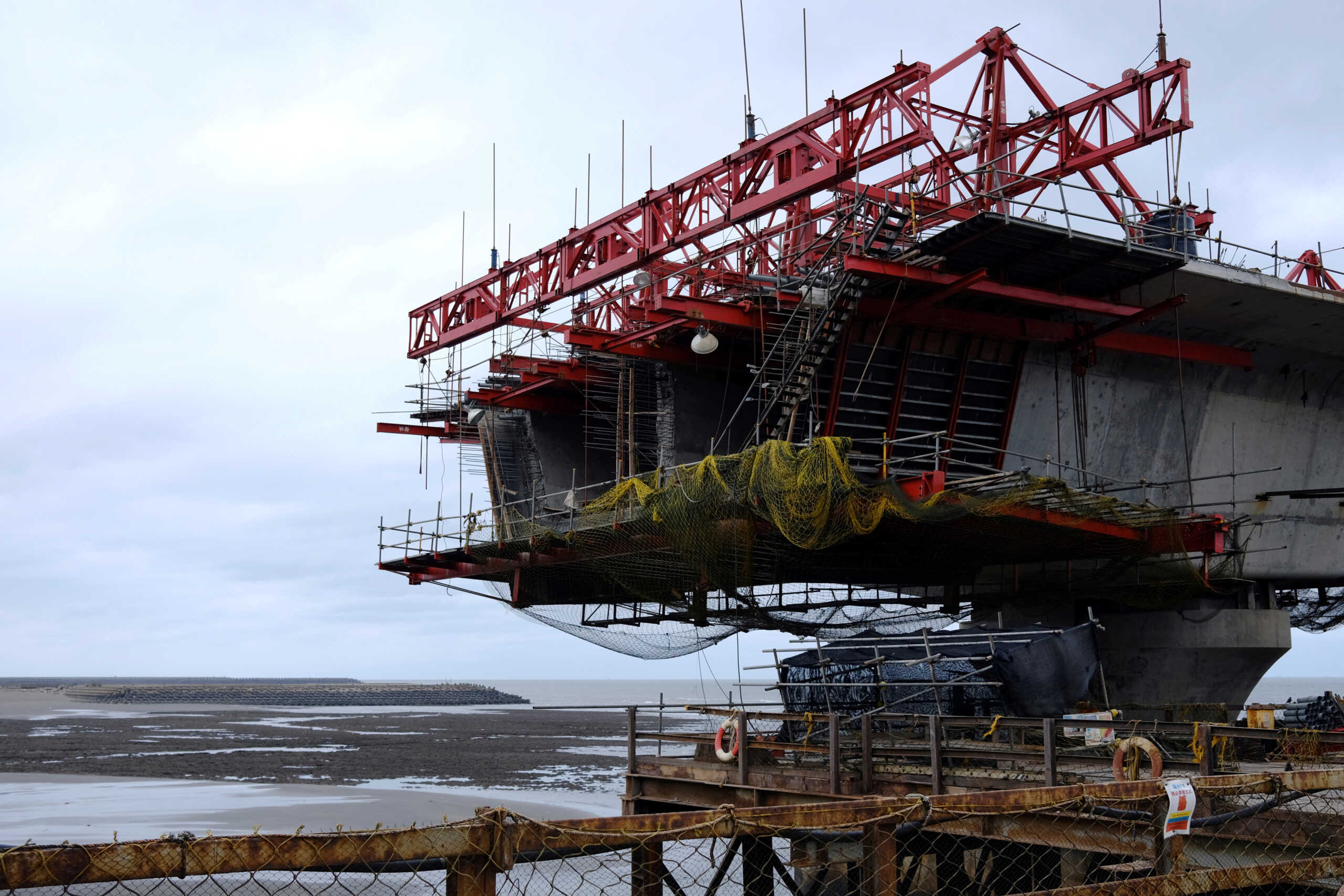 FILE PHOTO: The construction site of a planned liquefied natural gas (LNG) terminal is seen, ahead of a referendum on whether to relocate the terminal to protect the algal reef coast of Datan nearby, in Taoyuan, Taiwan November 25, 2021. Picture taken November 25, 2021. REUTERS