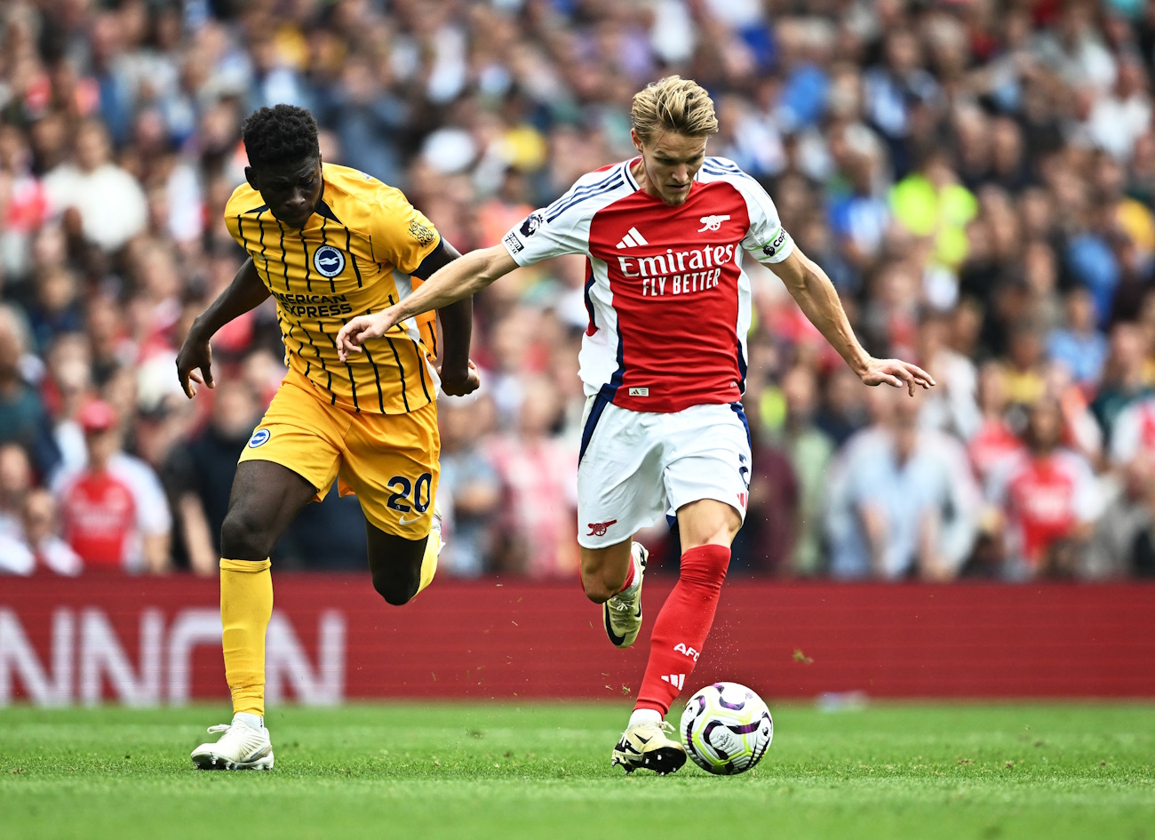 Soccer Football - Premier League - Arsenal v Brighton & Hove Albion - Emirates Stadium, London, Britain - August 31, 2024 Brighton & Hove Albion's Carlos Baleba in action with Arsenal's Martin Odegaard Action Images via Reuters