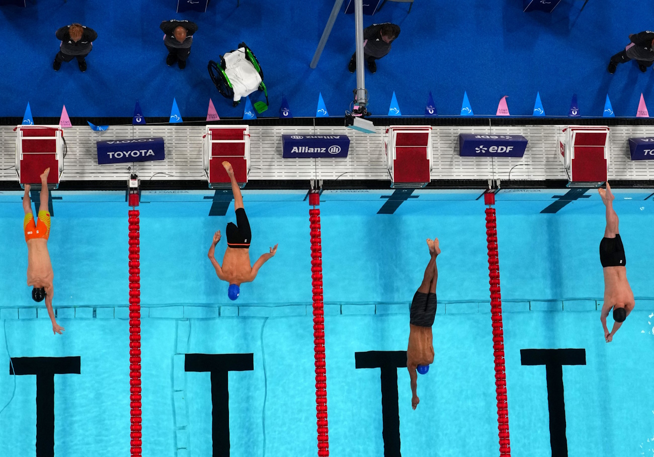 Paris 2024 Paralympics - Swimming - Men's 100m Butterfly - S8 Heats - Paris La Defense Arena, Nanterre, France - September 7, 2024 Ting Li of China, Alberto Amodeo of Italy, Gabriel Cristiano Silva de Souza of Brazil and Dimosthenis Michalentzakis of Greece in action REUTERS