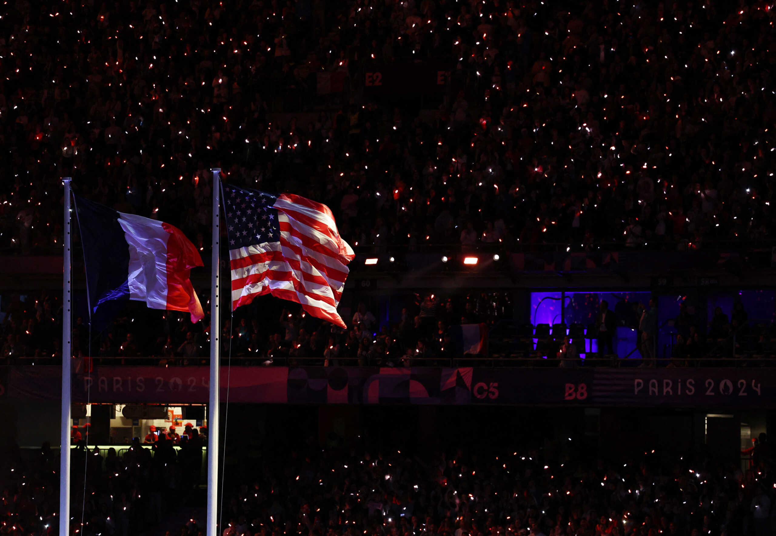 Paris 2024 Paralympics - Closing Ceremony - Paris, France - September 8, 2024 The flag of France and the flag of United States are raised during the closing ceremony REUTERS