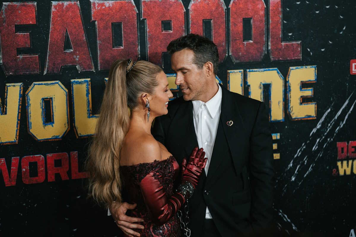 epa11492044 Canadian-American actor Ryan Reynolds (R) embraces his wife Blake Lively (L) at the premiere of the film 'Deadpool & Wolverine' in New York, New York, USA, 22 July 2024.  EPA