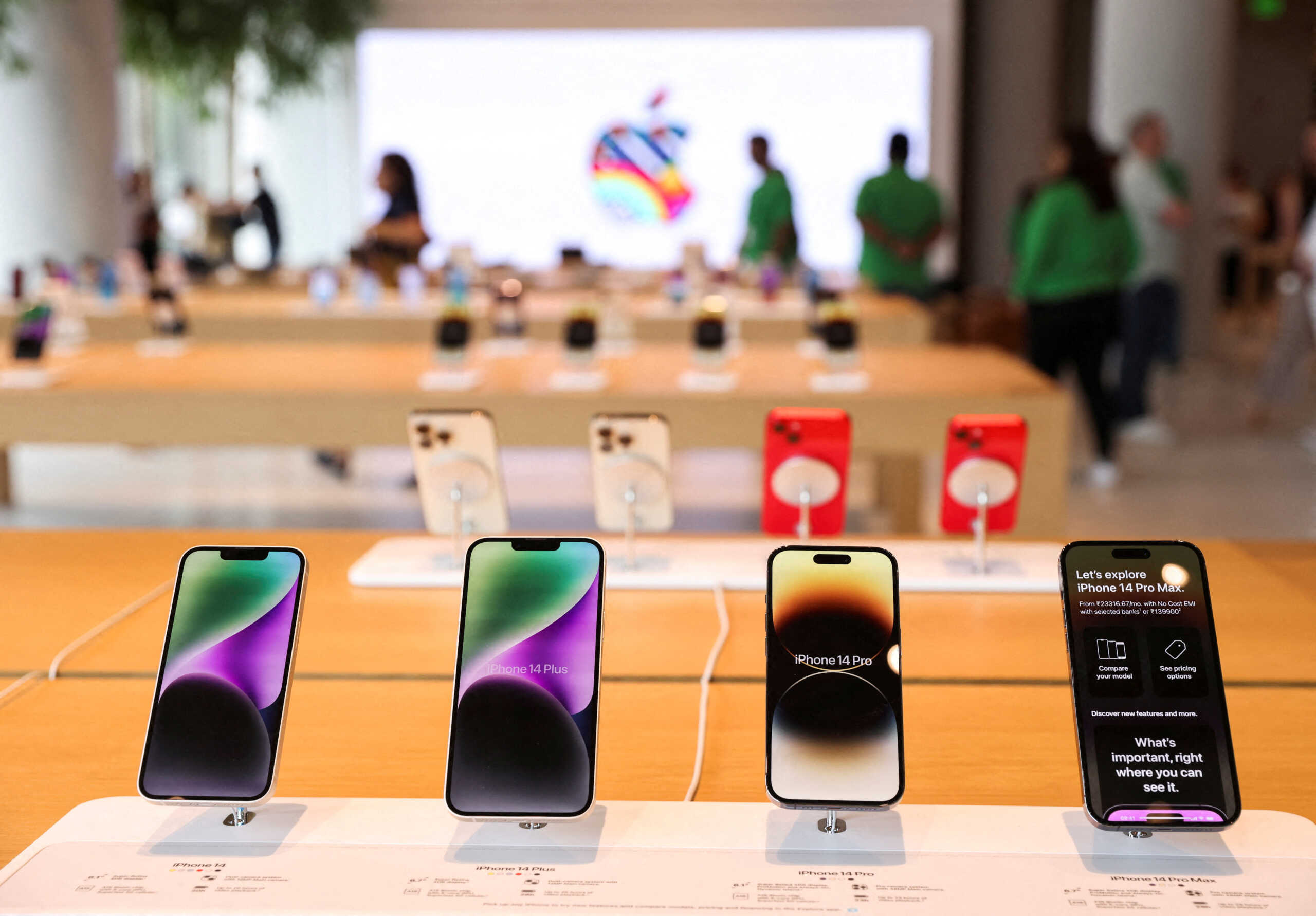 FILE PHOTO: Apple iPhones are seen inside India's first Apple retail store during a media preview, a day ahead of its launch in Mumbai, India, April 17, 2023. REUTERS