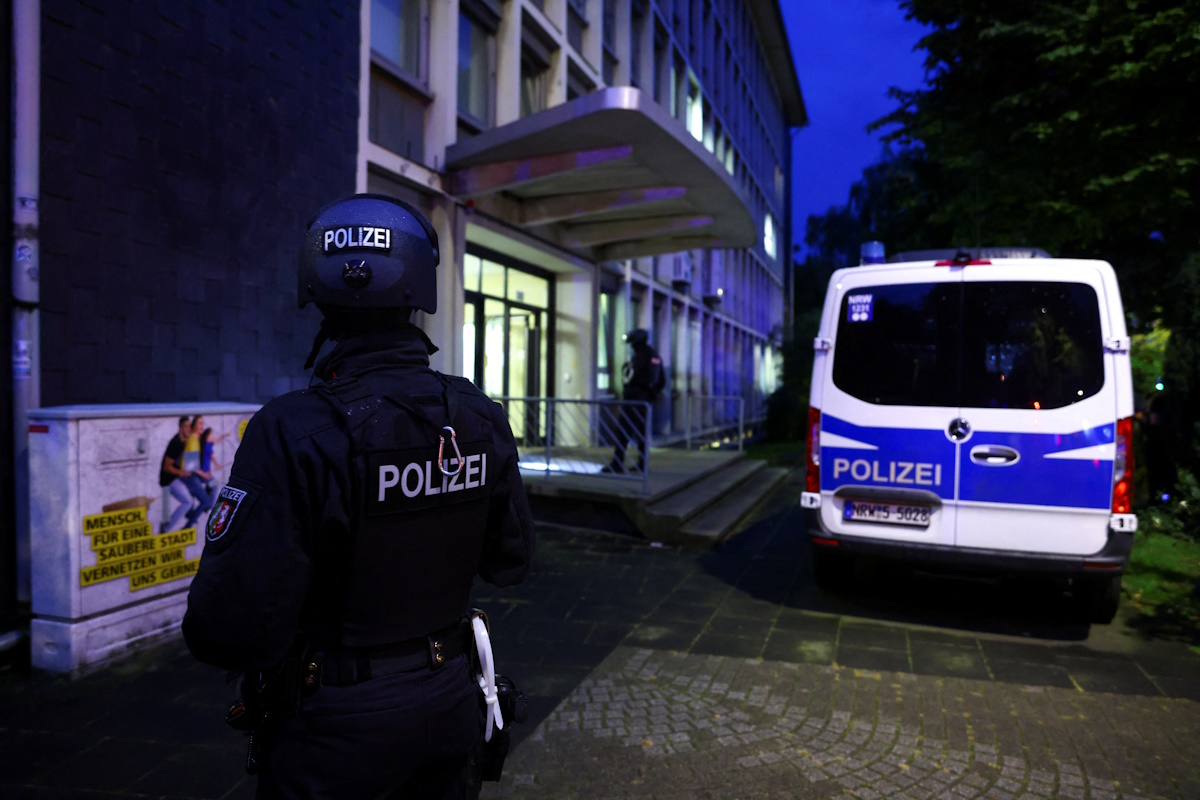 Special police forces officers stand guard outside of a building, following an incident in which several individuals were killed after a man randomly stabbed passers-by with a knife at a city festival, in Solingen, Germany, August 24, 2024. REUTERS