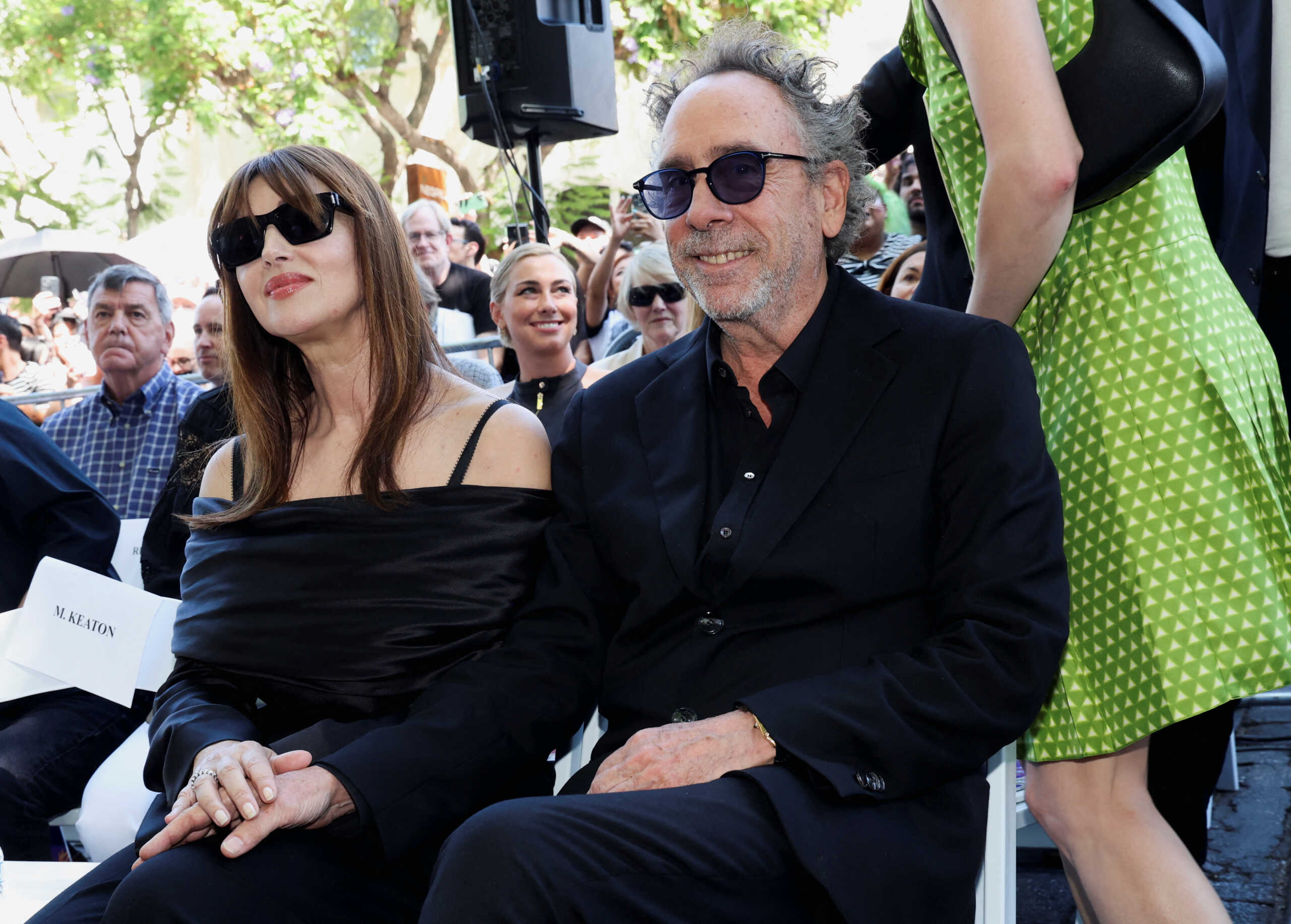 Tim Burton and partner Monica Bellucci sit at the ceremony honoring him with a star on the Hollywood Walk of Fame in Los Angeles, California, U.S., September 3, 2024. REUTERS