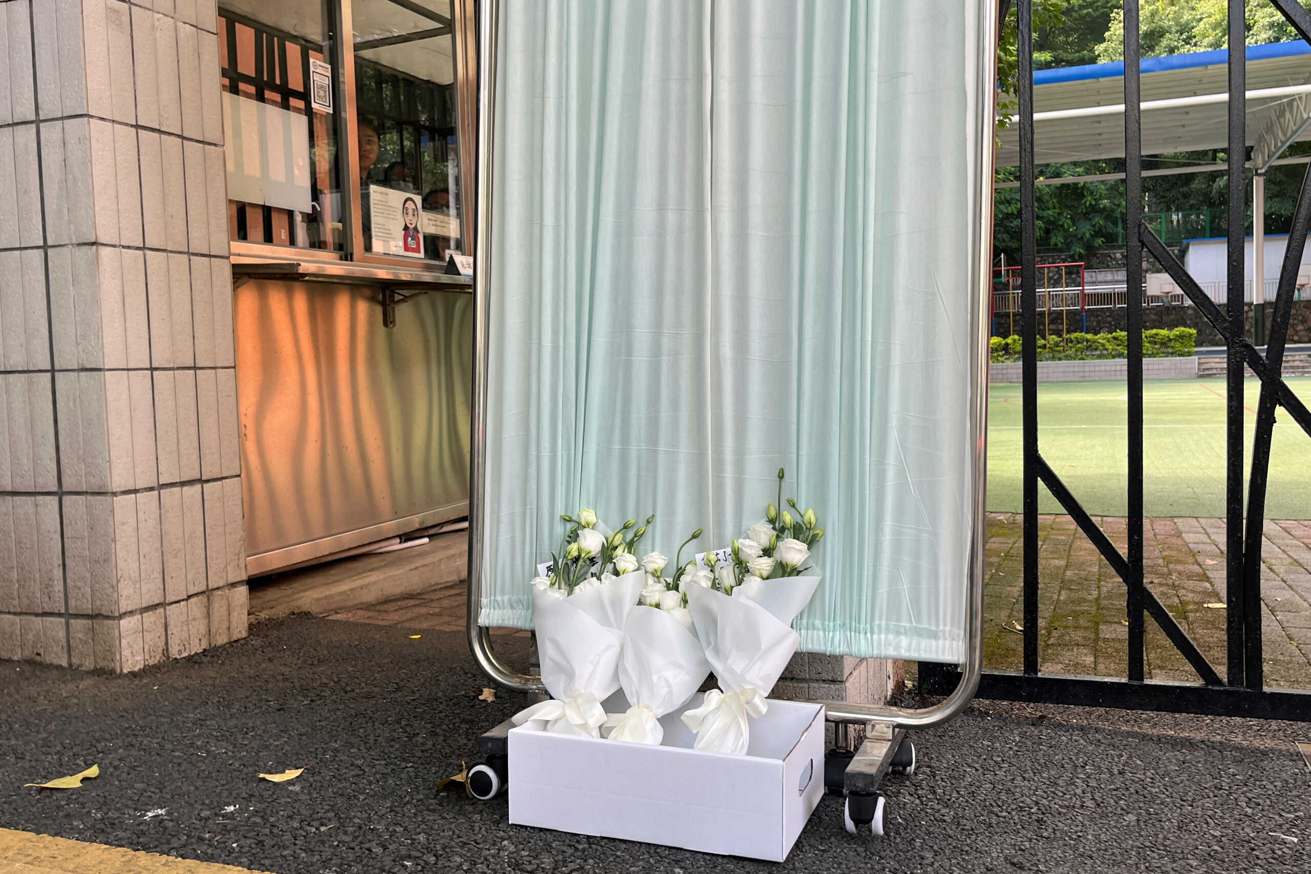 Flower bouquets lay outside Shenzhen Japanese School, following the death of a 10-year-old child after being stabbed by an assailant on the way to the school, in Shenzhen, Guangdong province, China September 19, 2024. REUTERS